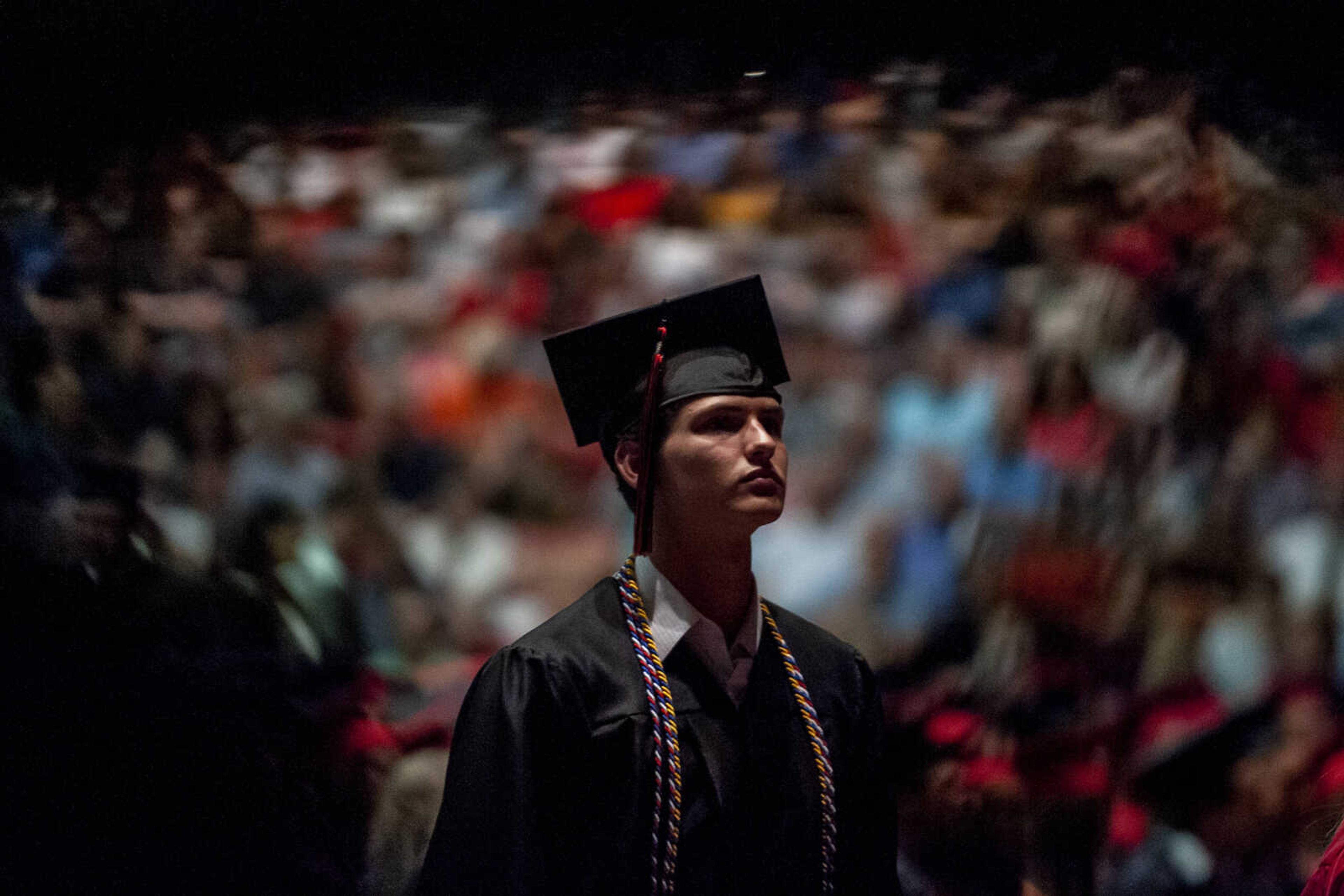 Ethan Cossey stands and waits before walking across the stage to earn his high school diploma during the Jackson High School Class of 2019 Commencement at the Show Me Center Friday, May 24, 2019, in Cape Girardeau.