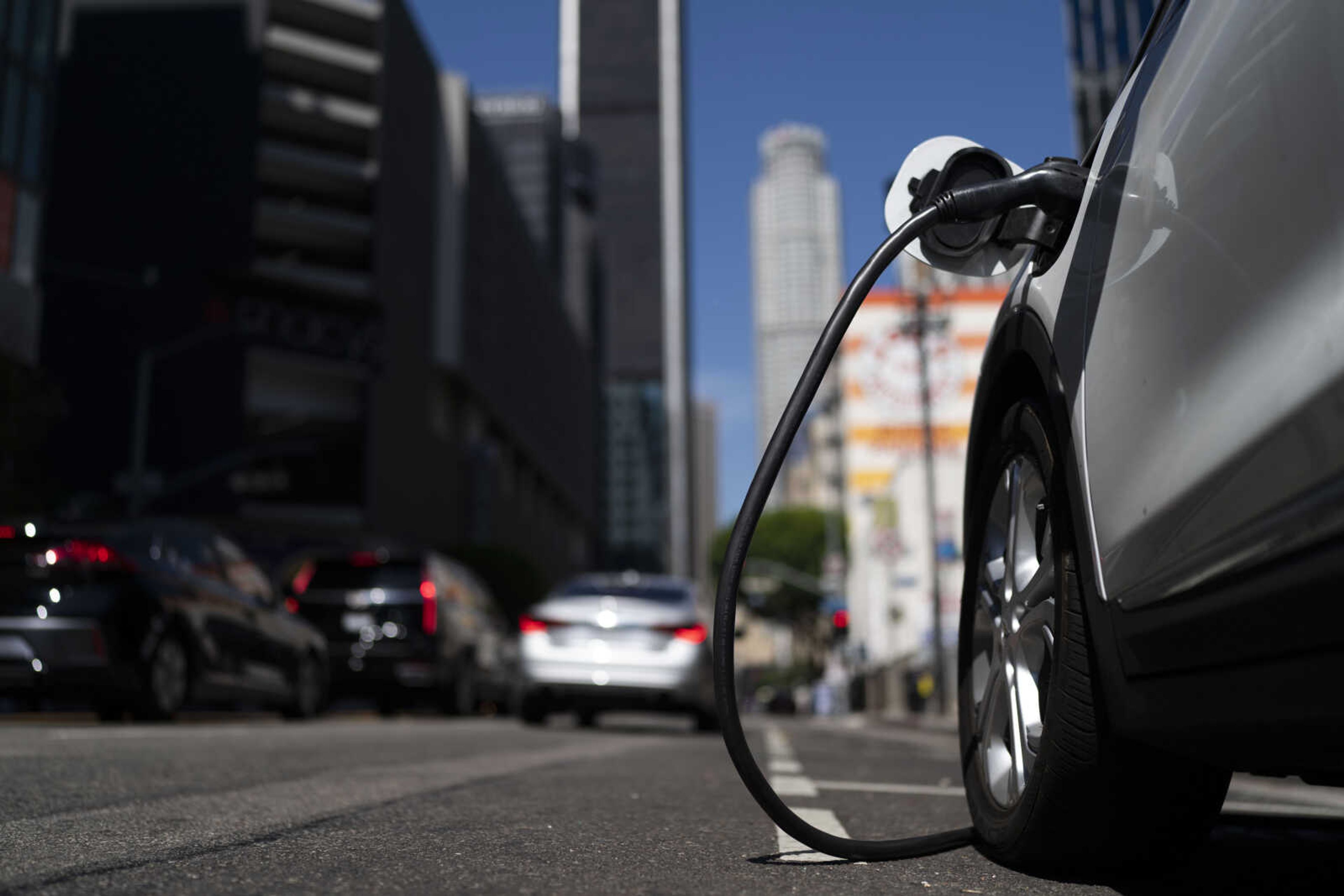 An electric vehicle is plugged into a charger Aug. 25 in Los Angeles.