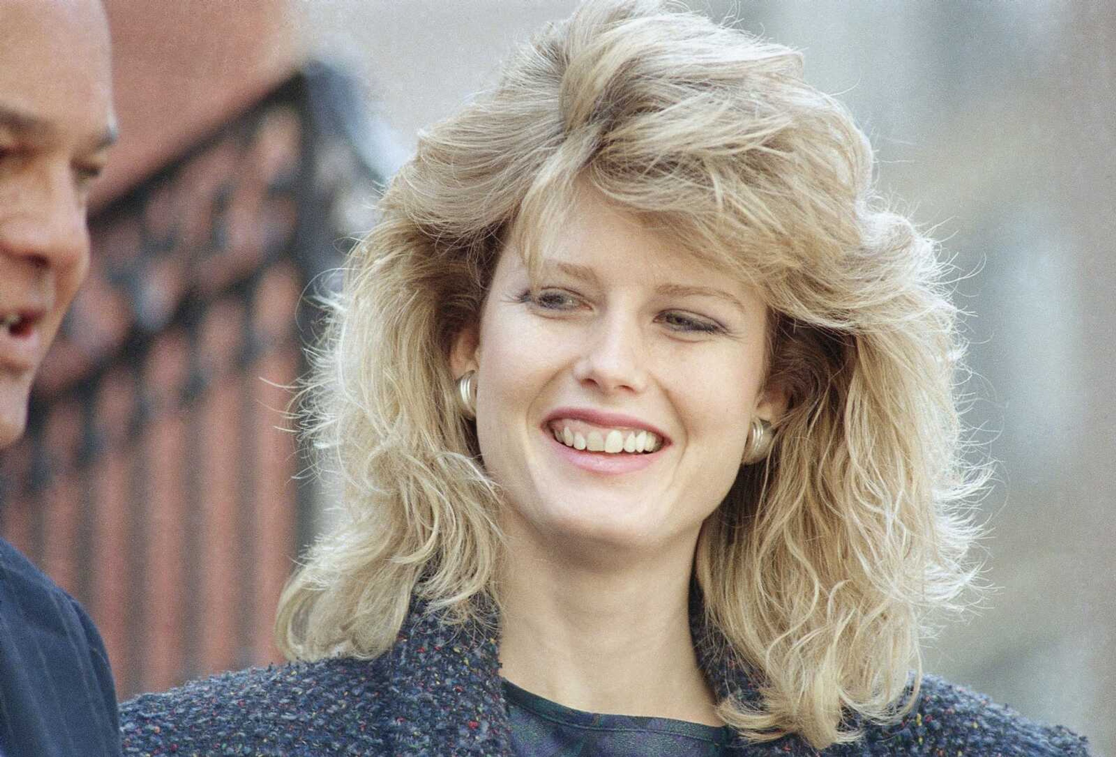 Fawn Hall, former secretary to ousted National Security Council Lt. Col. Oliver, speaks to reporters outside her lawyers' office Feb. 24, 1987, in Washington. Hall testifed in the Iran-Contra trial of former White House national security adviser John Poindexter, said she removed documents from North's office after he was fired even though she knew she wasn't supposed to do so.