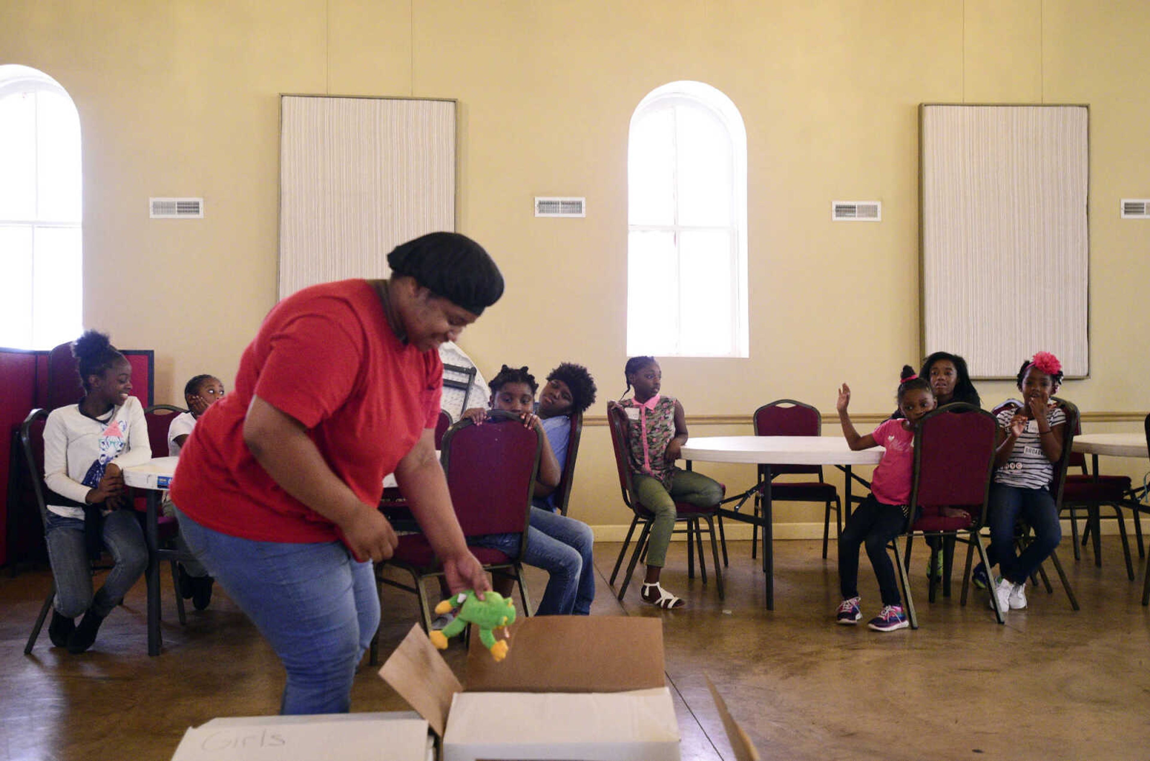 Chamika Moore pulls out prizes the girls can get after earning so many "shekels" for good deeds on Monday, Aug. 14, 2017, during the Salvation Army's after school program at The Bridge Outreach Center in Cape Girardeau.