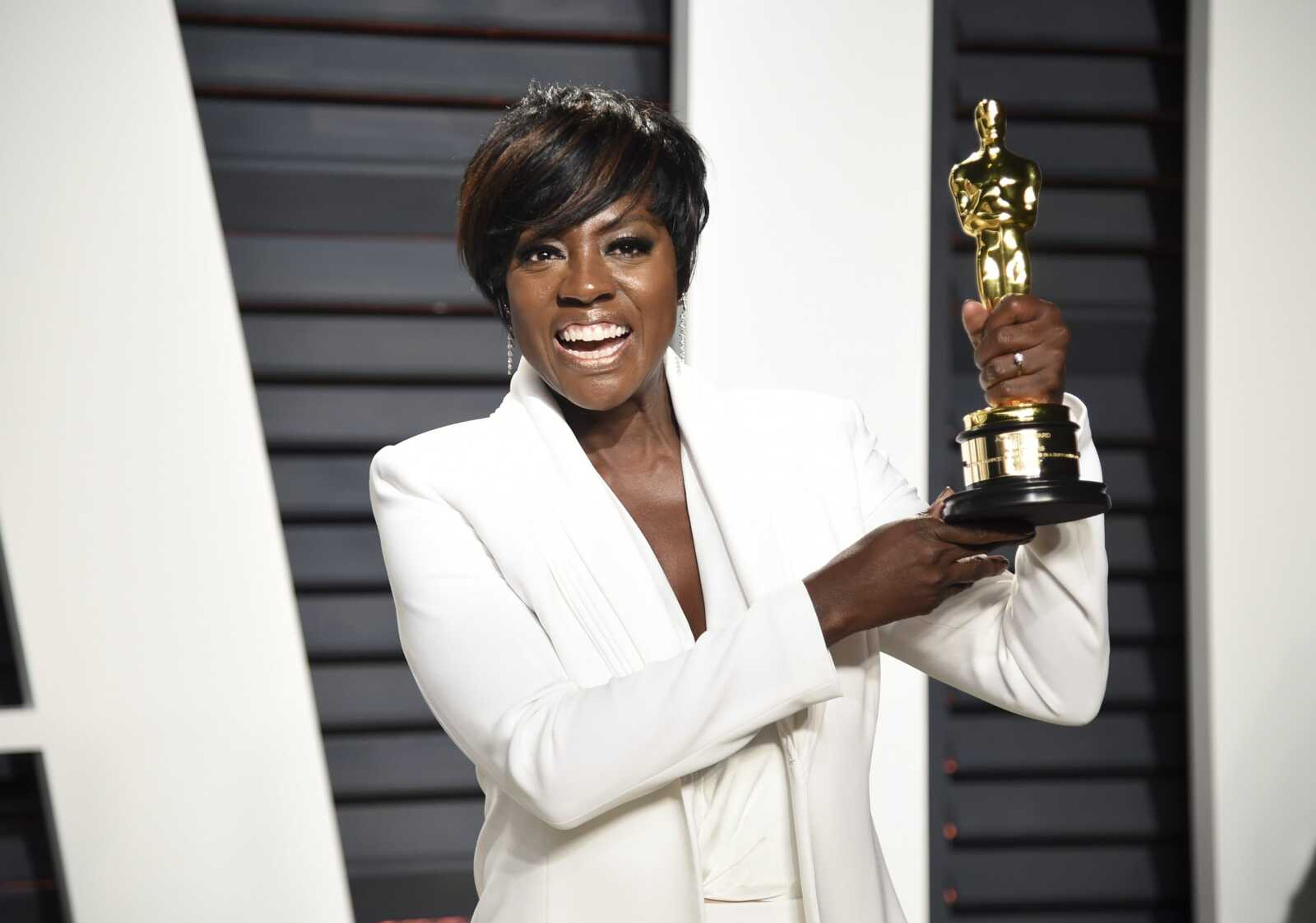 Viola Davis holds her Oscar for best supporting actress for her role in "Fences" at the Feb. 27, 2017, Vanity Fair Oscar Party in Beverly Hills, California. In a 2018 interview with journalist Tina Brown, Davis said while people have termed her "a black Meryl Streep" she isn't paid what she's worth.