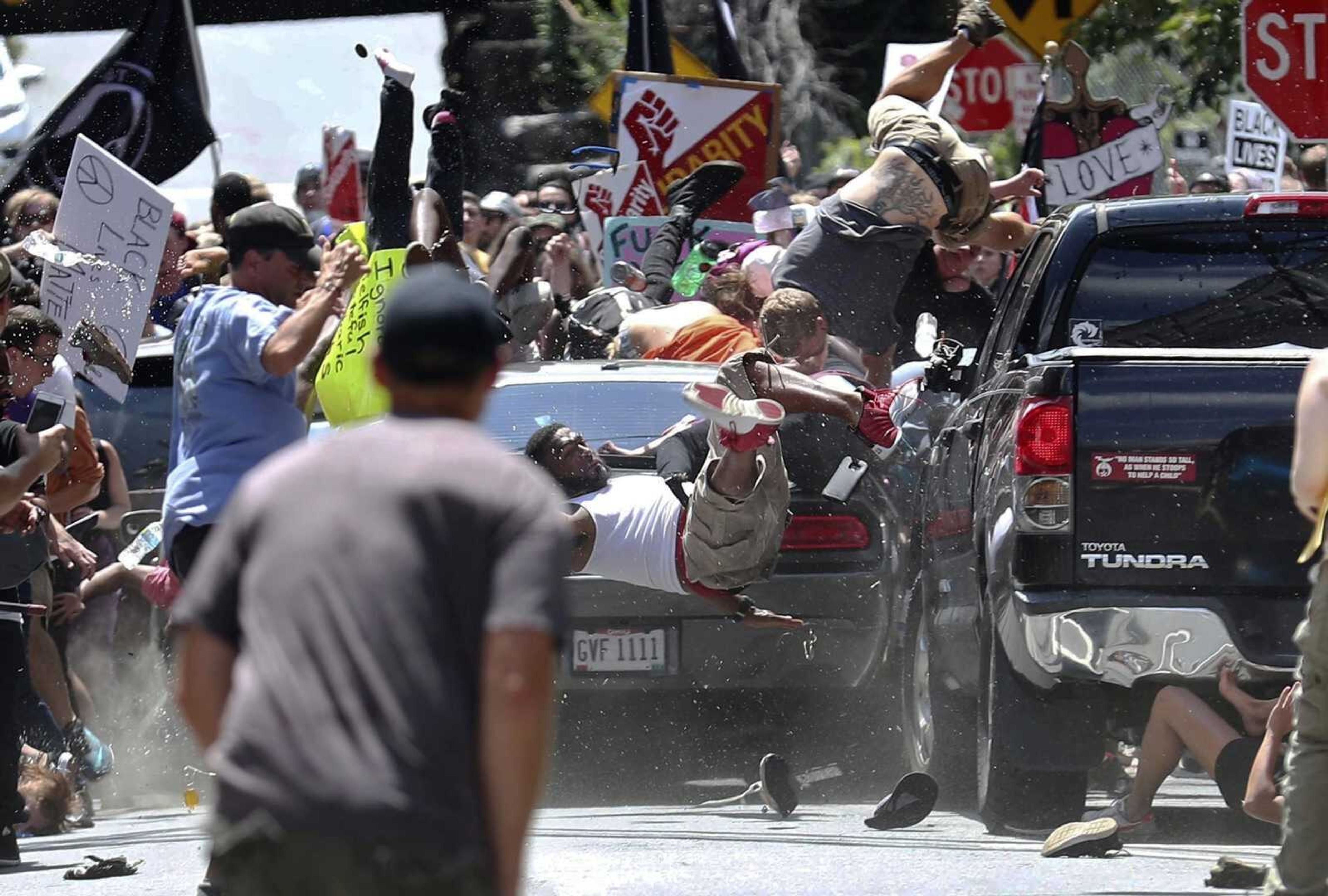 People fly into the air Aug. 12, 2017, as a vehicle is driven into a group of protesters demonstrating against a white nationalist rally in Charlottesville, Virginia. James Alex Fields Jr., the man convicted of driving into the crowd, was sentenced to life in prison for the attack, which killed one.