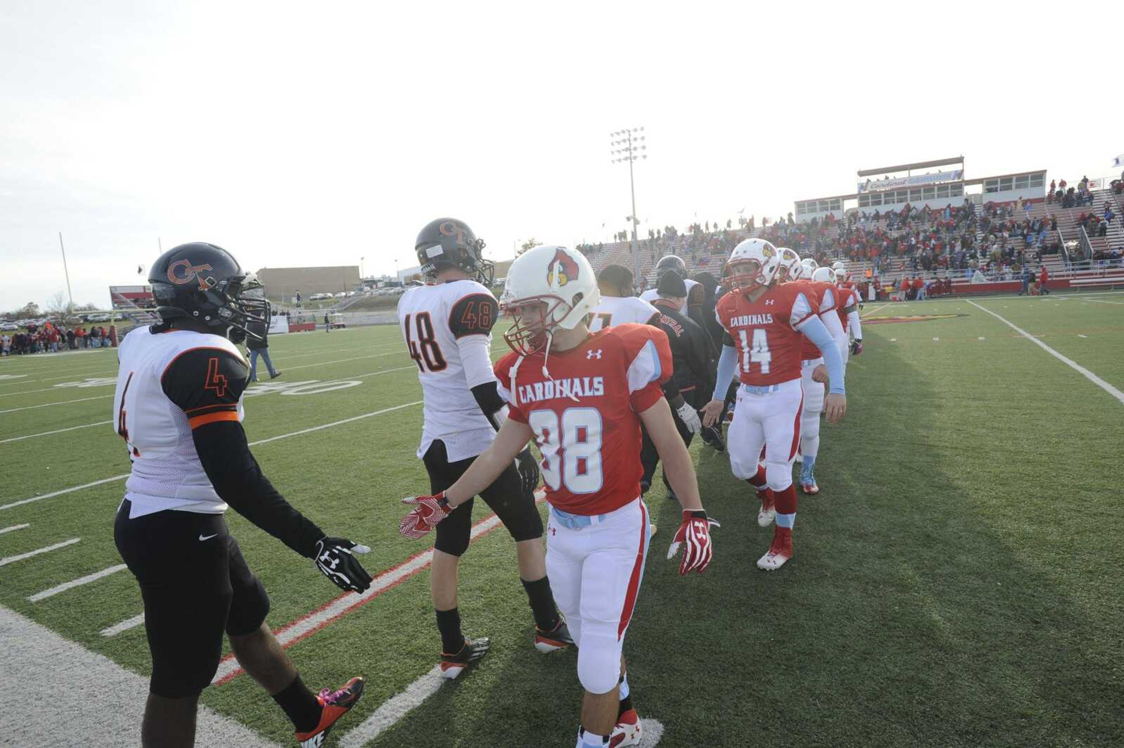 The Webb City Cardinals, shown following their defeat of Central last season, will attempt to claim their 13th state title against the Tigers on Saturday at the Edward Jones Dome in St. Louis. Webb City won its first state title in 1989 under the direction of former coach Jerry Kill, who now coaches at the University of Minnesota. (Southeast Missourian file)