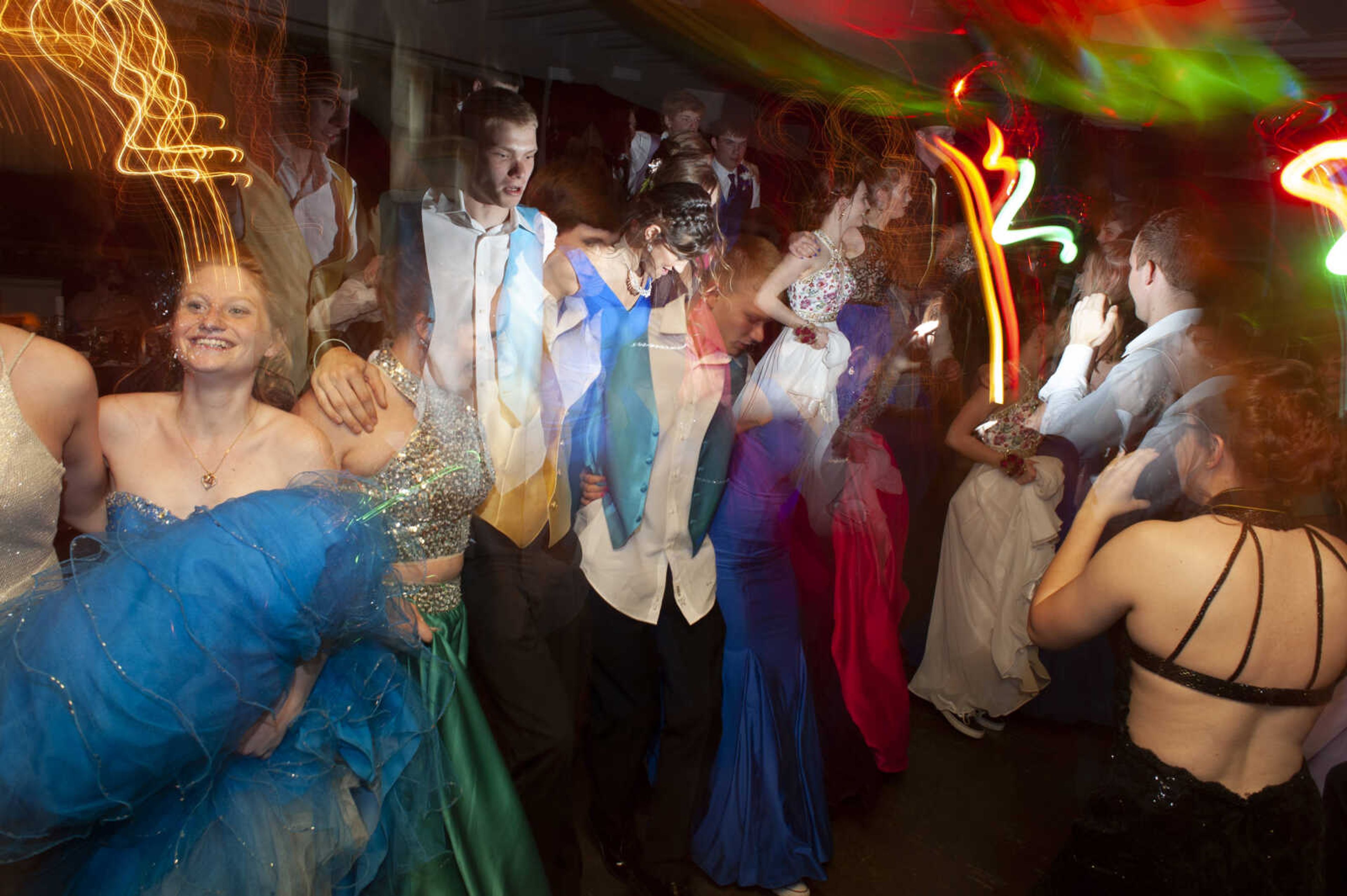 Prom guests dance during Leopold High School's "Masquerade at Midnight" prom Saturday, April 27, 2019, in Leopold.