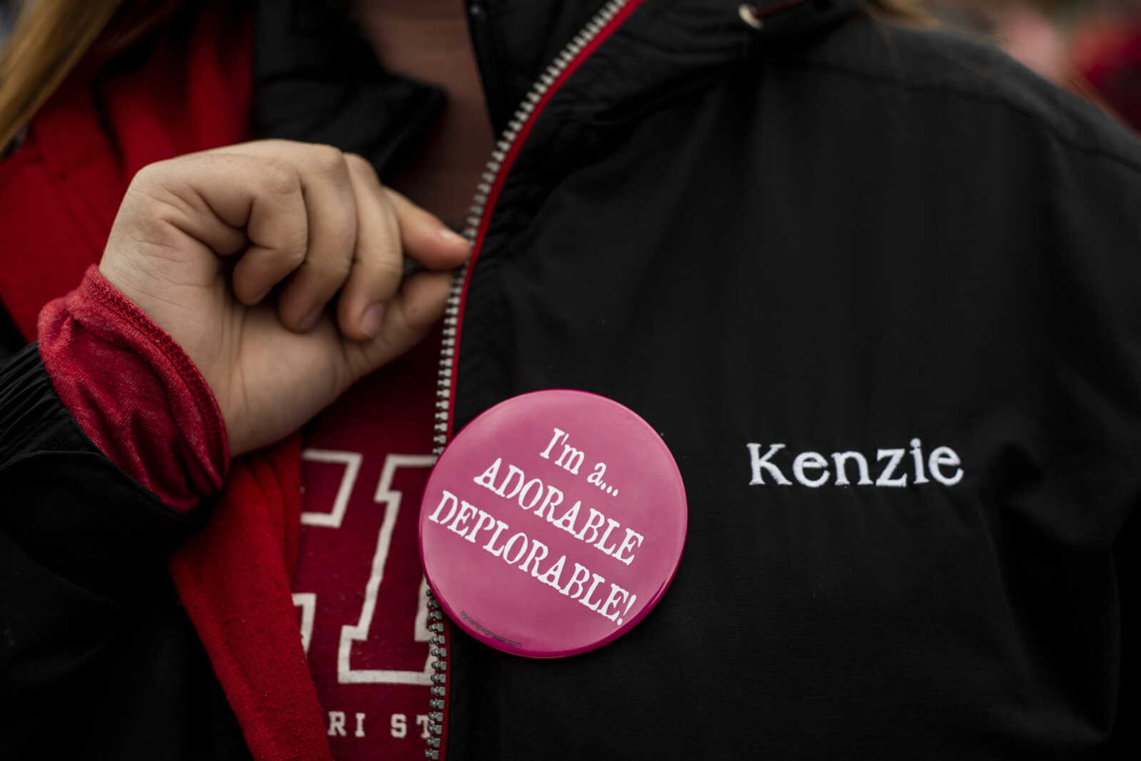 MacKenzie Justis, 22, wears a pin that reads "I'm a... ADORABLE DEPLORABLE" outside of the Show Me Center Monday, Nov. 5, 2018, in Cape Girardeau.