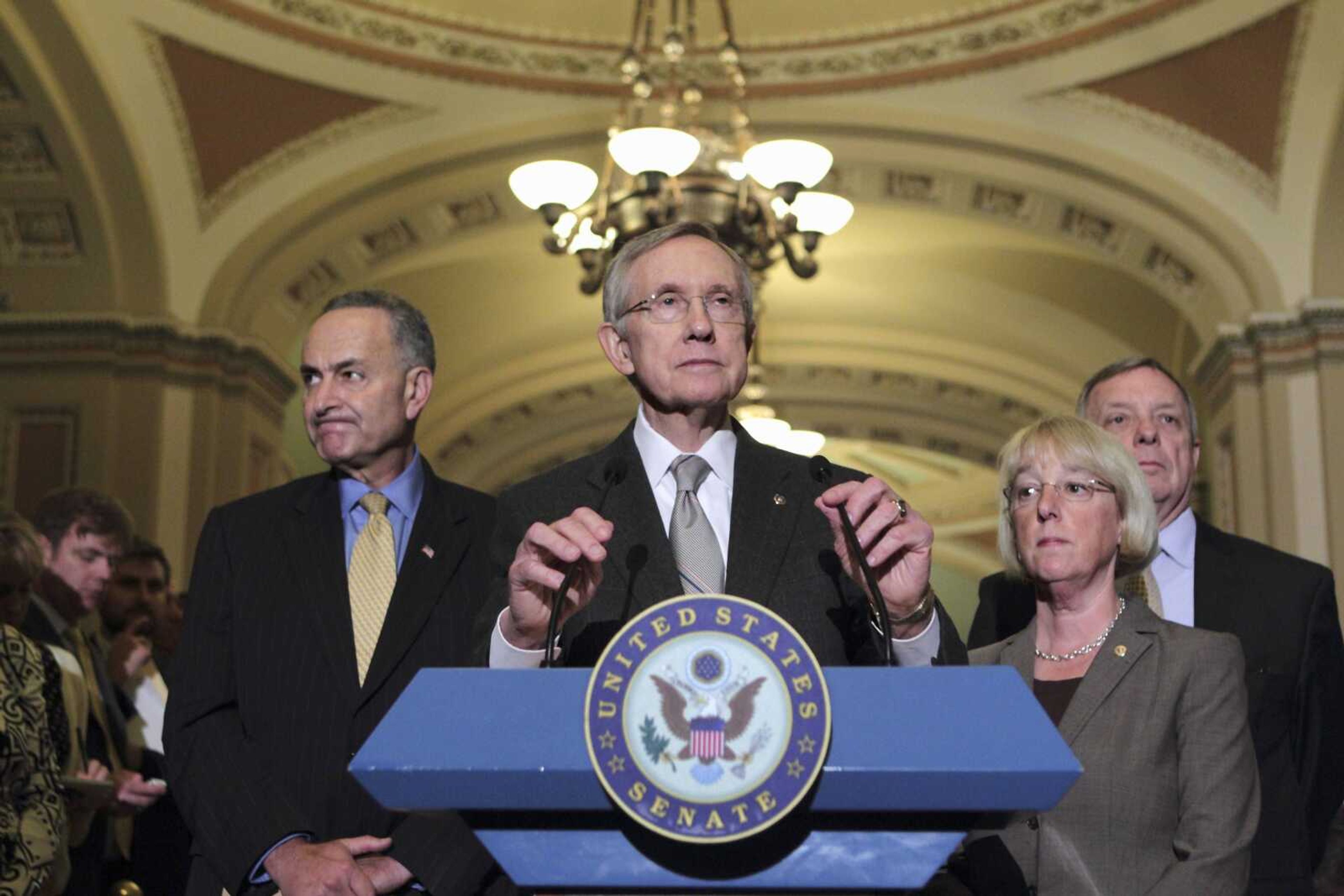 Senate Majority Leader Harry Reid of Nev., center, accompanied by fellow Senate Democratic leaders, spoke on Capitol Hill in Washington, Tuesday, Aug. 2, 2011, after passage of the emergency legislation to prevent a default on government debt obligations. From left are, Sen. Charles Schumer, D-N.Y., Reid, Sen. Patty Murray, D-Wash., and Senate Majority Whip Richard Durbin of Ill (AP Photo/J. Scott Applewhite)