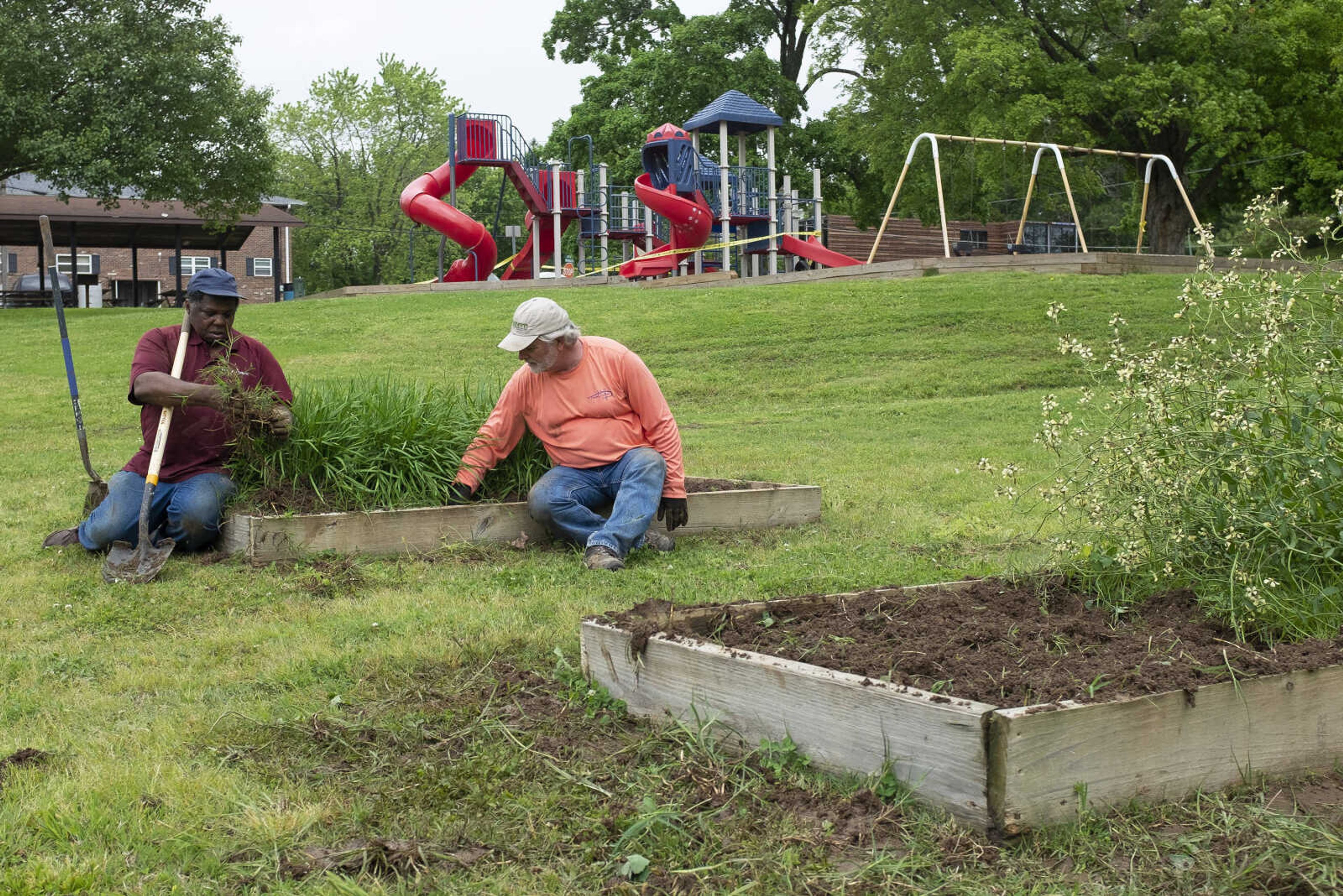 Robert Harris Jr. (left), originally of Scott County, Missouri, and now Cape Girardeau, and Sven Svenson, a professor of agribusiness and horticulture at Southeast Missouri State University, tend to gardening Saturday, May 16, 2020, at Washington Park Community Garden in Cape Girardeau.