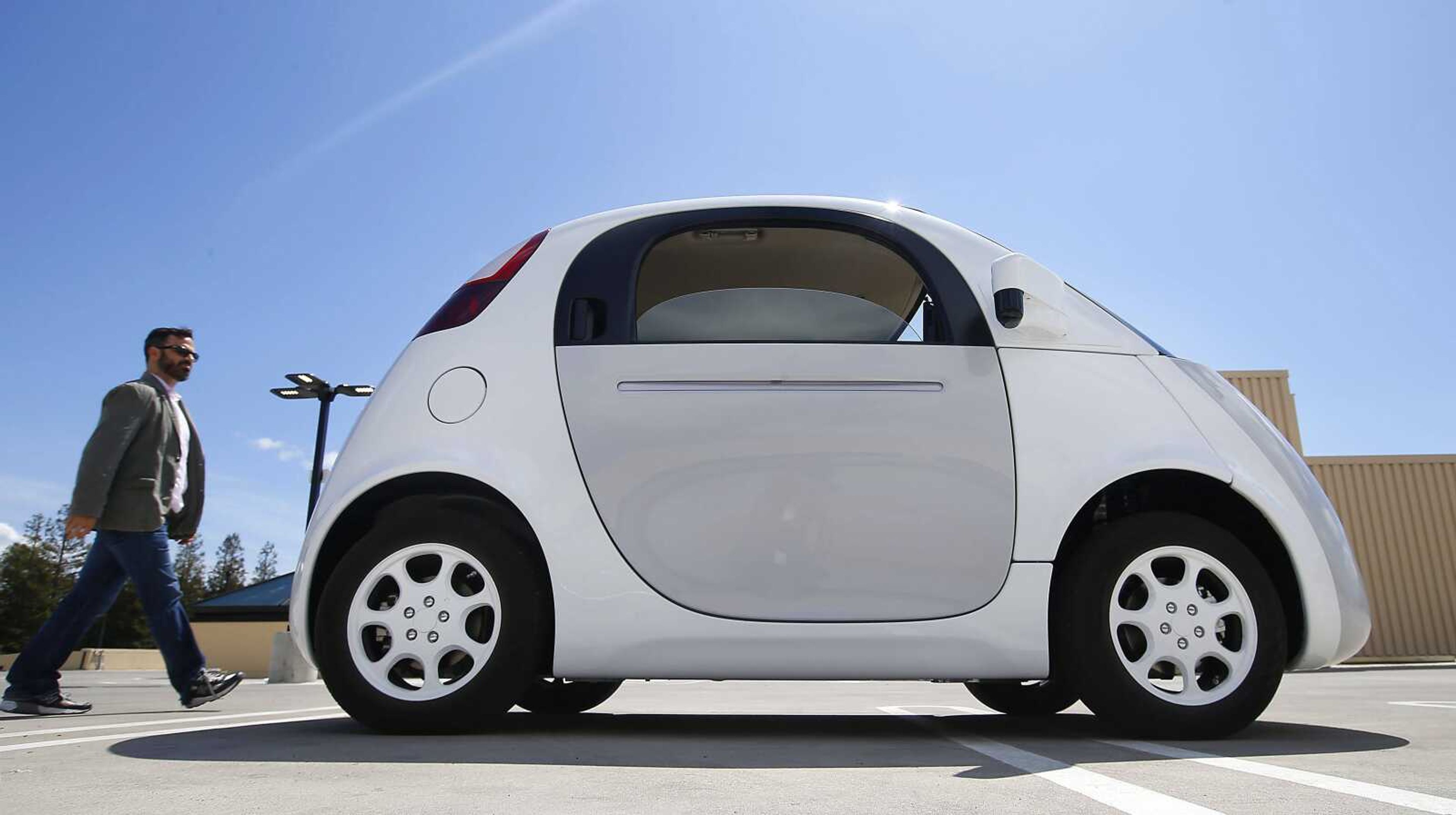 Google's new self-driving prototype is shown from the side during a demonstration Wednesday at Google in Mountain View, California.  The car needs no gas pedal or steering wheel. (Tony Avelar ~ Associated Press)