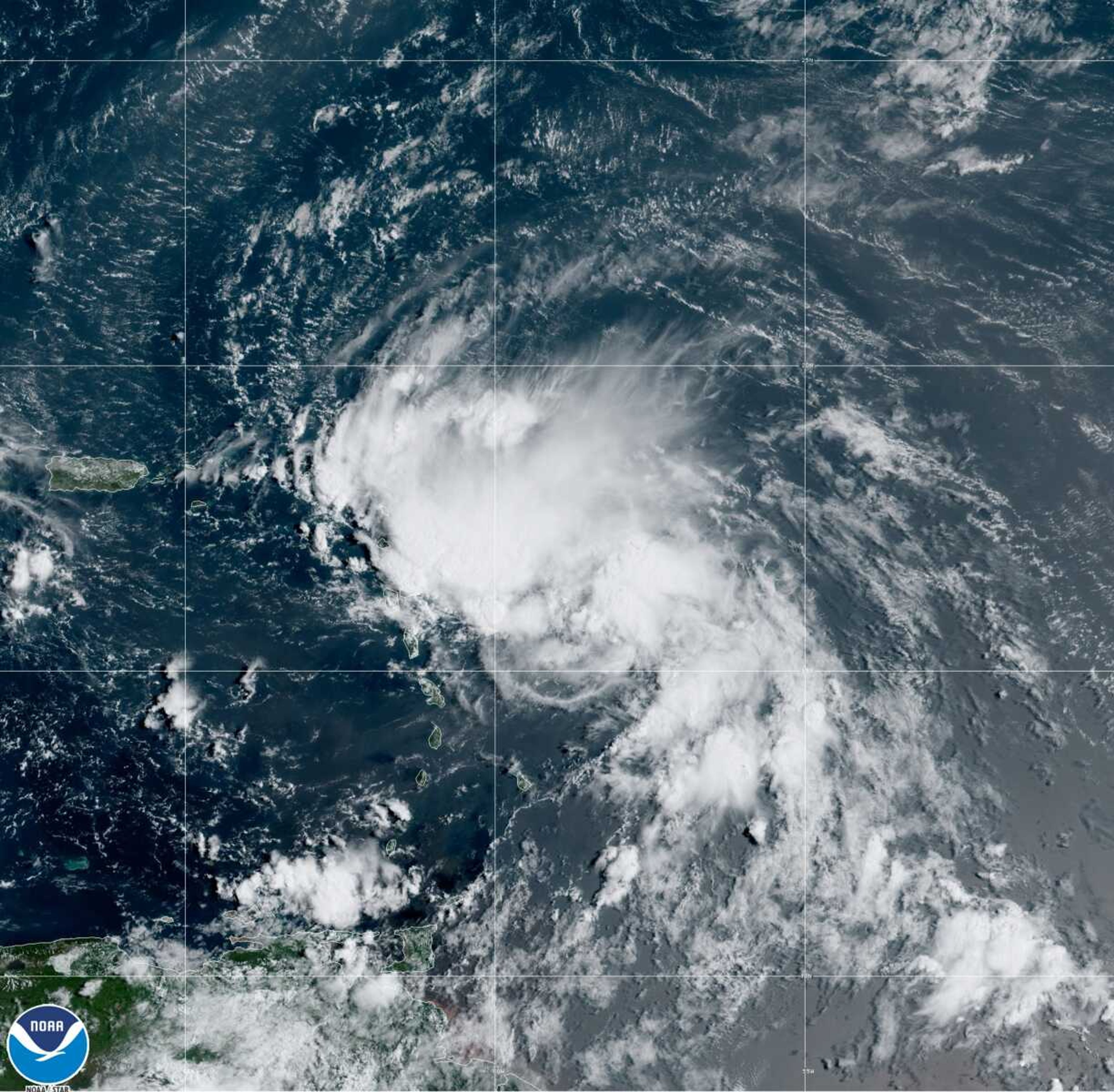 This satellite image released by the National Oceanic and Atmospheric Administration shows Tropical Storm Laura on Friday in the North Atlantic Ocean. Laura formed Friday in the eastern Caribbean and forecasters said it poses a potential hurricane threat to Florida and the U.S. Gulf Coast. A second storm also may hit the U.S. after running into Mexico's Yucatan Peninsula.