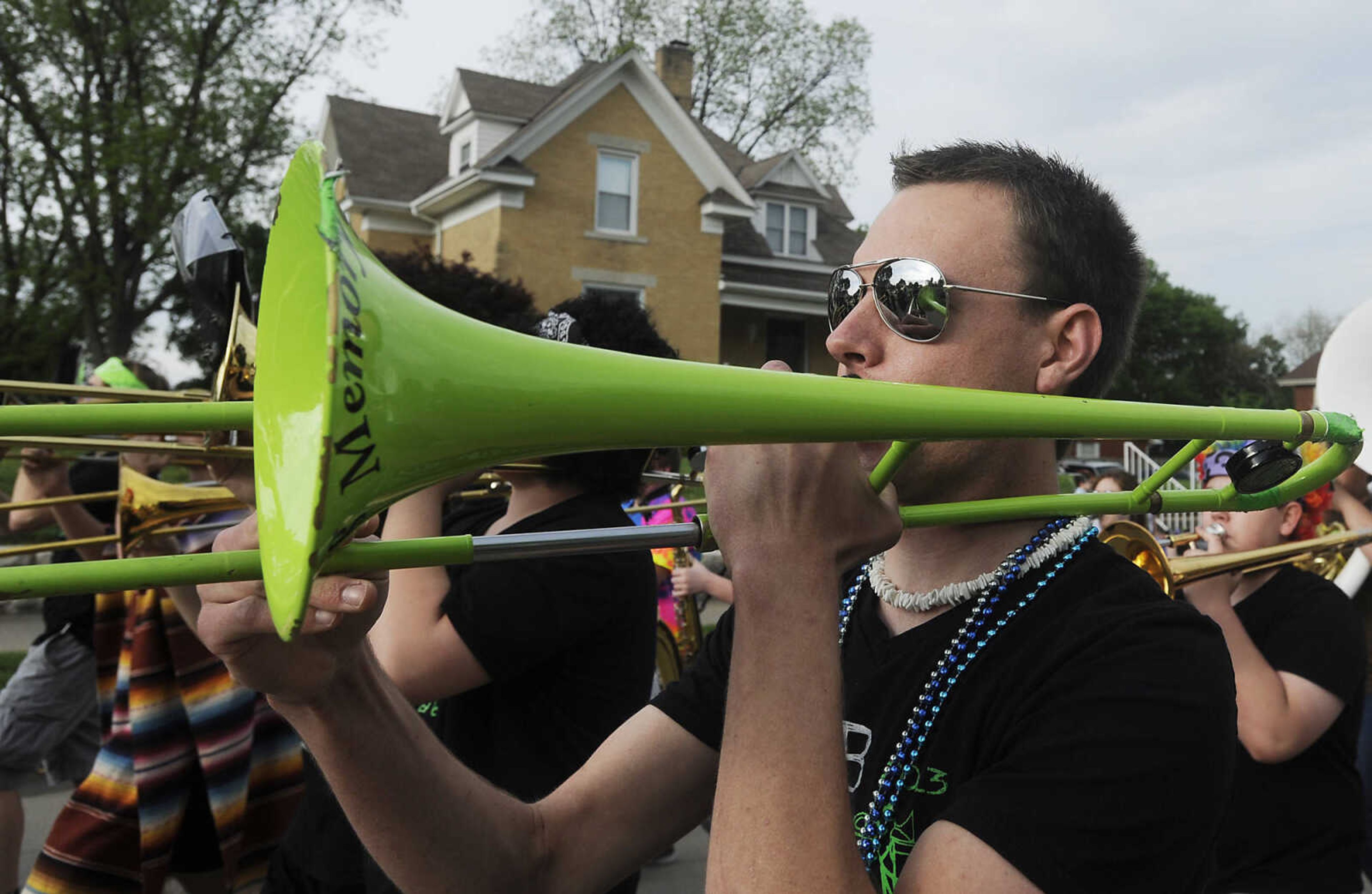 Brett Beier, 19, performs with the Perryville High School Marching Band during the Perryville Mayfest Parade Friday, May 10, in Perryville, Mo. This year's Mayfest theme is Peace, Love, Perryville Mayfest.