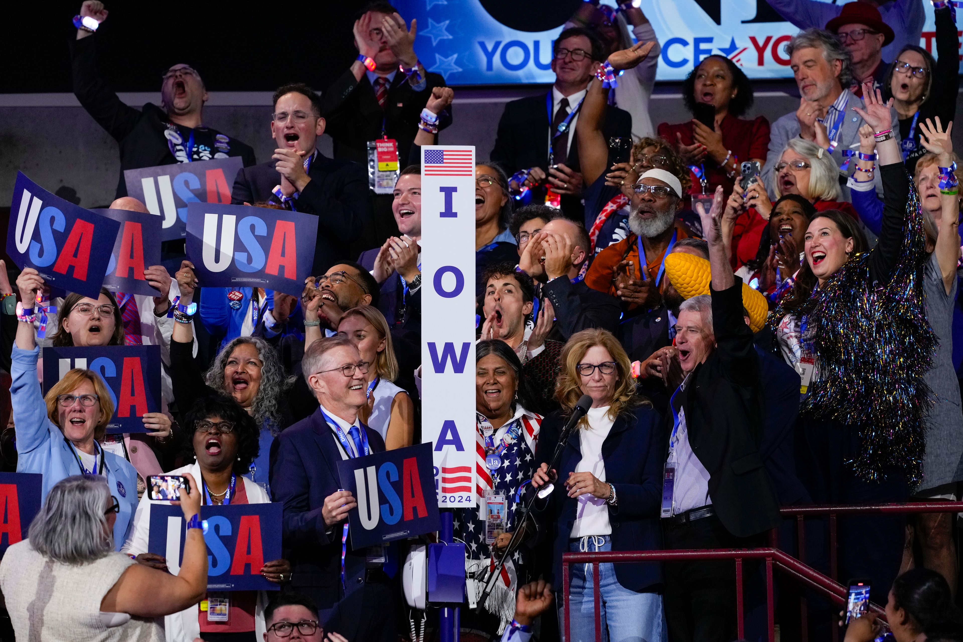 Members of the Iowa delegation cheering during roll call at the Democratic National Convention Tuesday, Aug. 20, 2024, in Chicago. (AP Photo/J. Scott Applewhite)