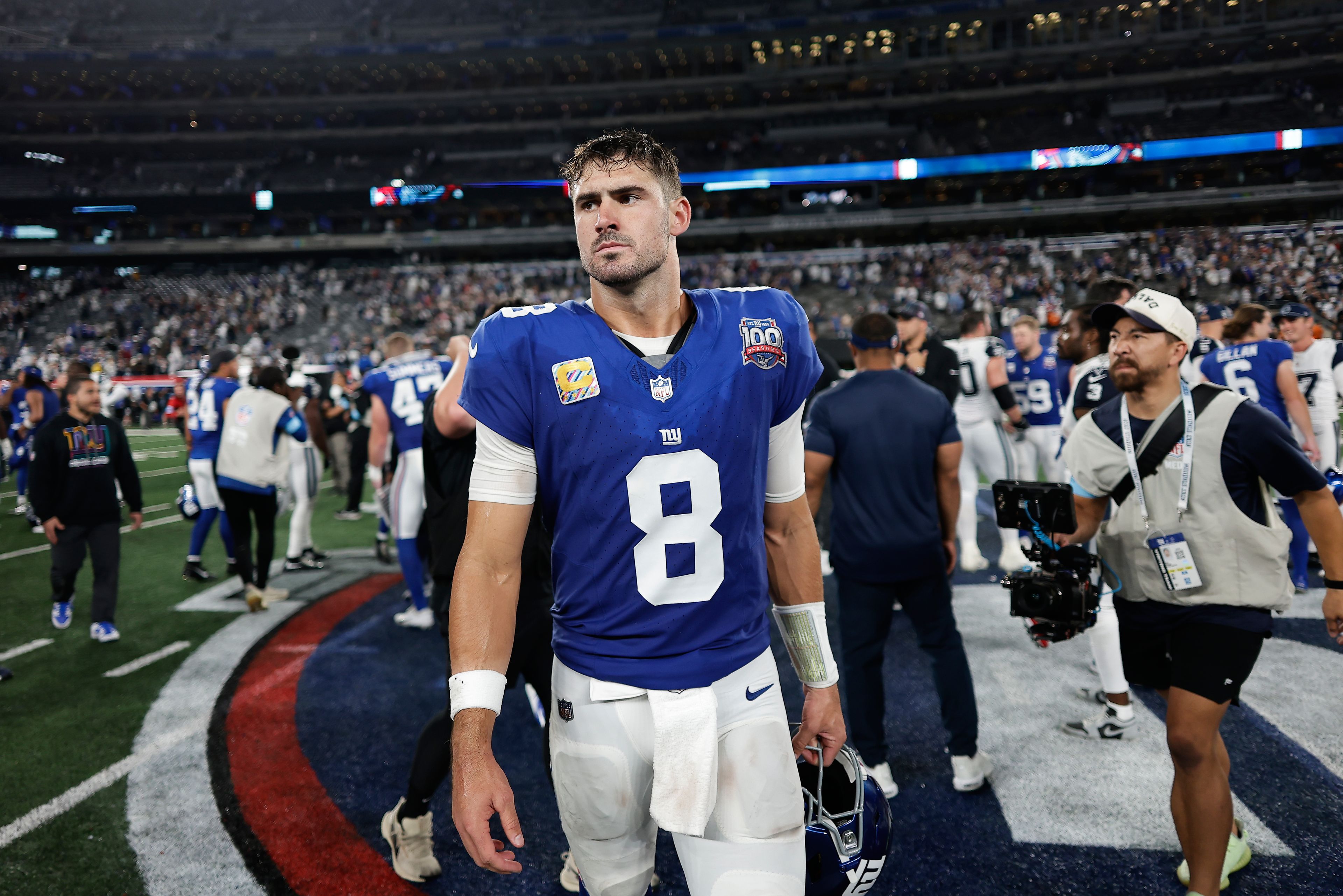 New York Giants quarterback Daniel Jones (8) walks off the field after playing against the Dallas Cowboys in an NFL football game, Thursday, Sept. 26, 2024, in East Rutherford, N.J. (AP Photo/Adam Hunger)