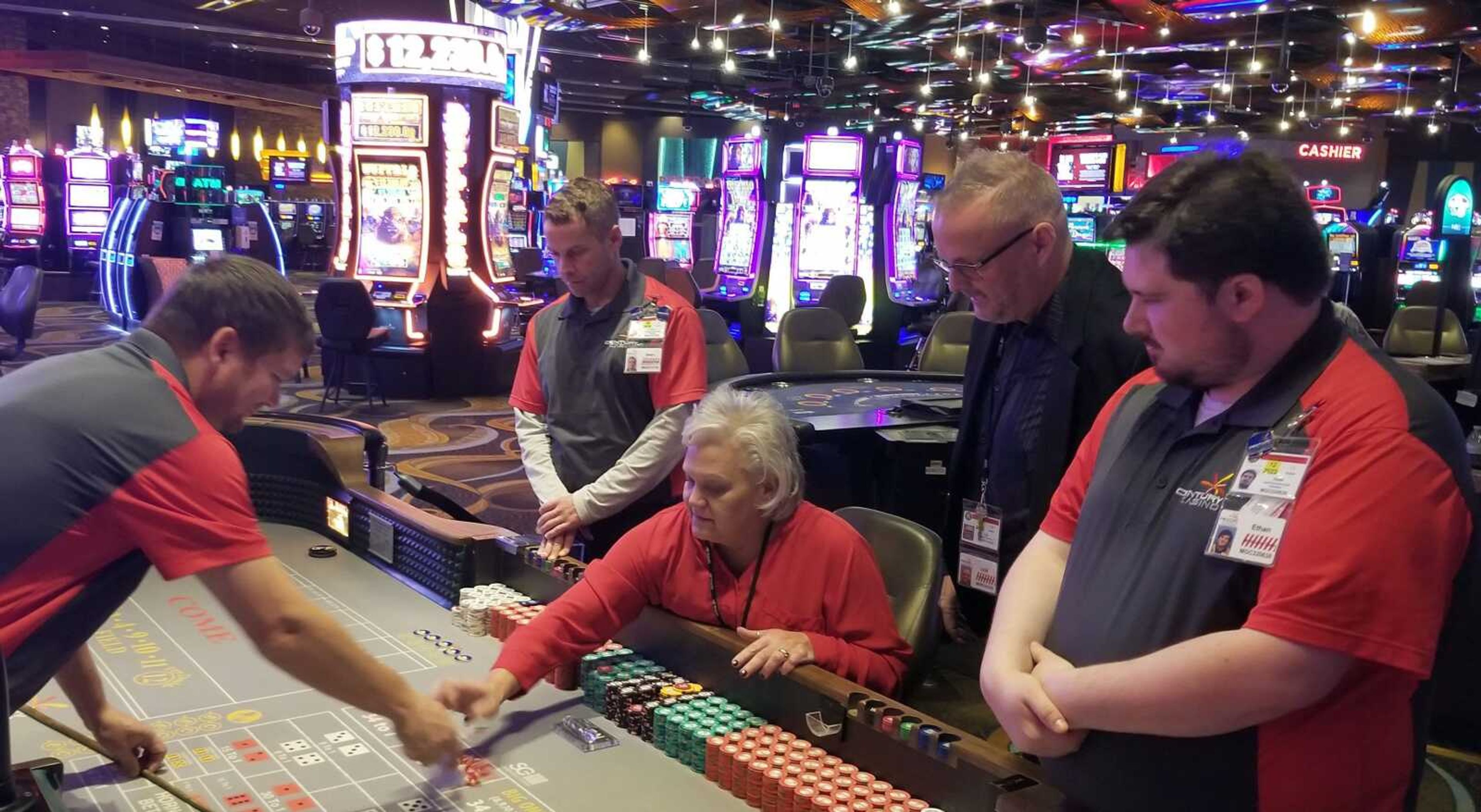 General manager Lyle Randolph joins casino employees at a gaming table at Century Casino Cape Girardeau. The latest admission statistics for the two casinos in Southeast Missouri have been released by Missouri Gaming Commission. The figures show increases at both casinos, especially at Century Casino Caruthersville, which has posted double digit increases in admissions compared to a year ago in the last three months