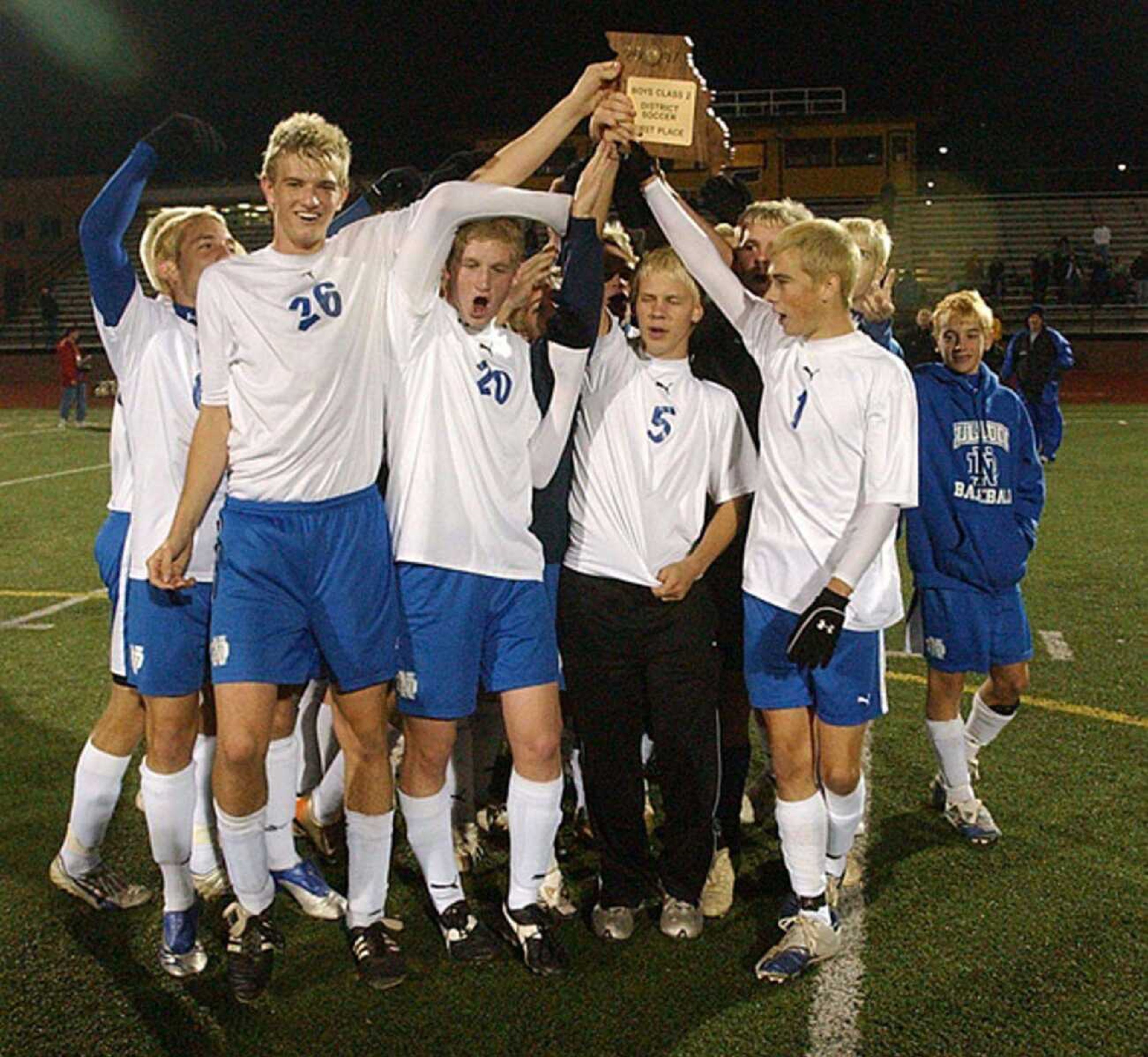 The Bulldogs raised their district trophy after their 2-0 victory over De Soto on Wednesday in Farmington. (Andrew Jansen/Special to the Southeast Missourian)