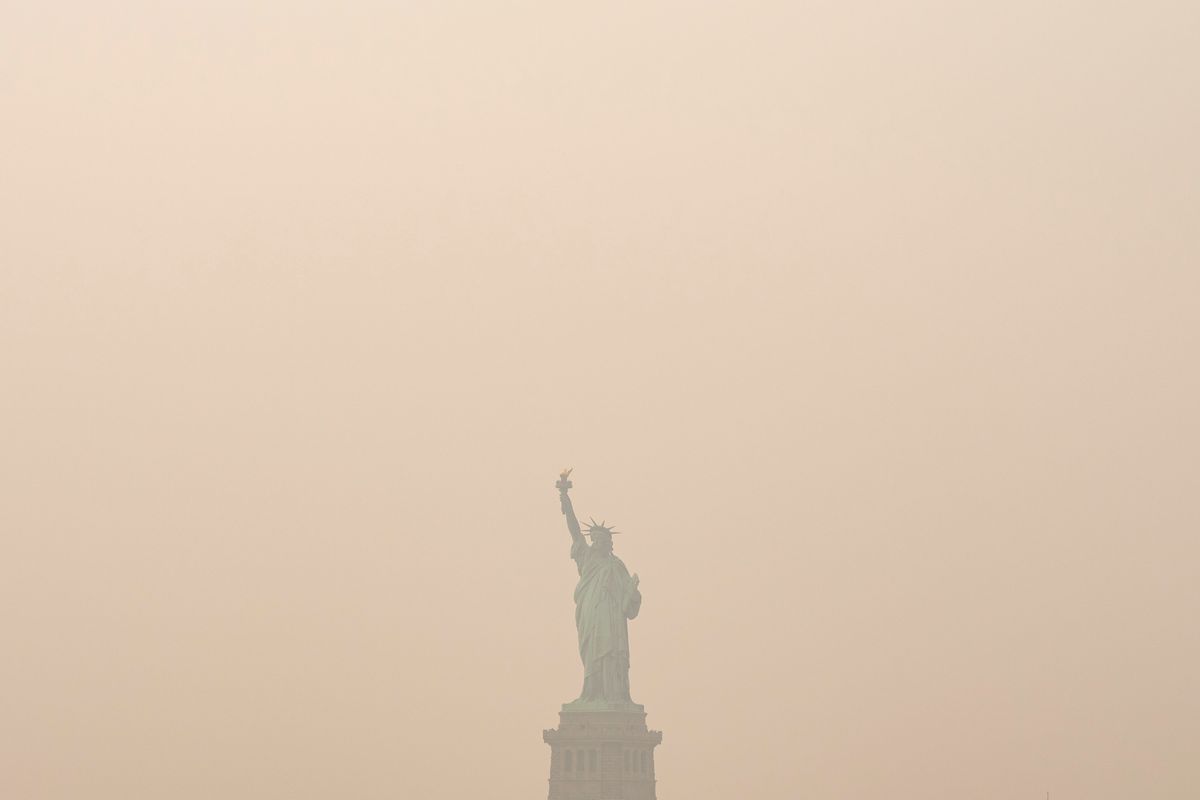Heavy smoke from wildfires is darkening skies from the US Mi...