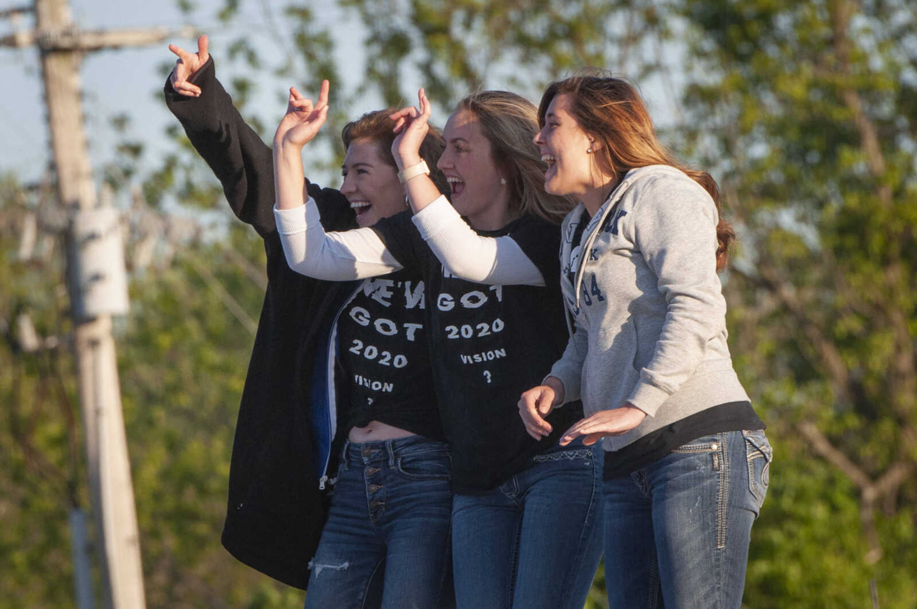 Oak Ridge High School seniors, from right, Chloe Hamilton, Alexis Lukefahr and Lexi Dillard take pictures following a senior parade Friday, May 8, 2020, in Oak Ridge.