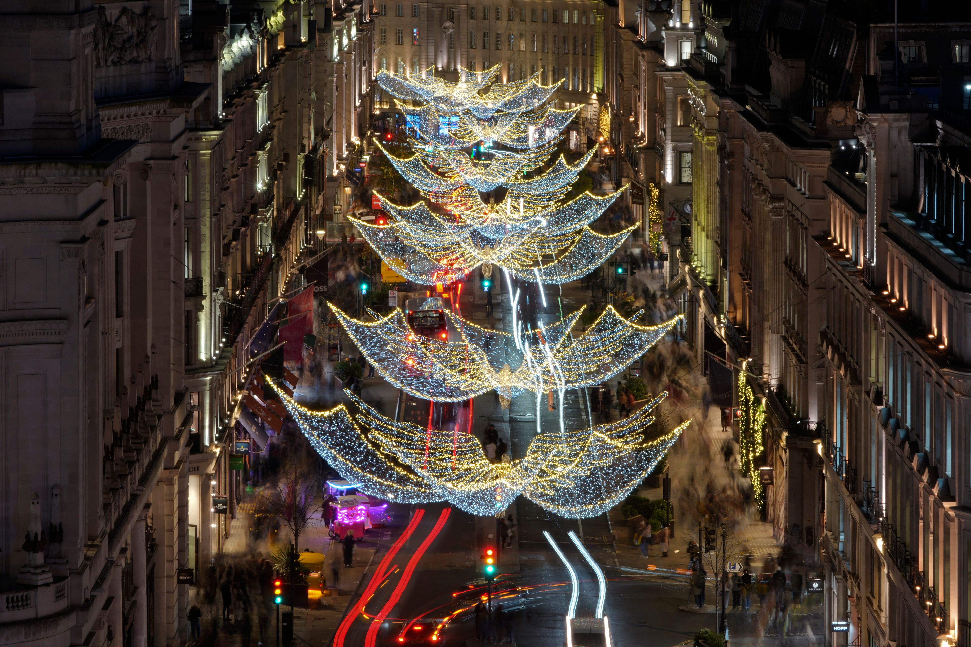 Christmas lights are displayed on Regent Street, in London, Wednesday, Nov. 20, 2024. (AP Photo/Kin Cheung)