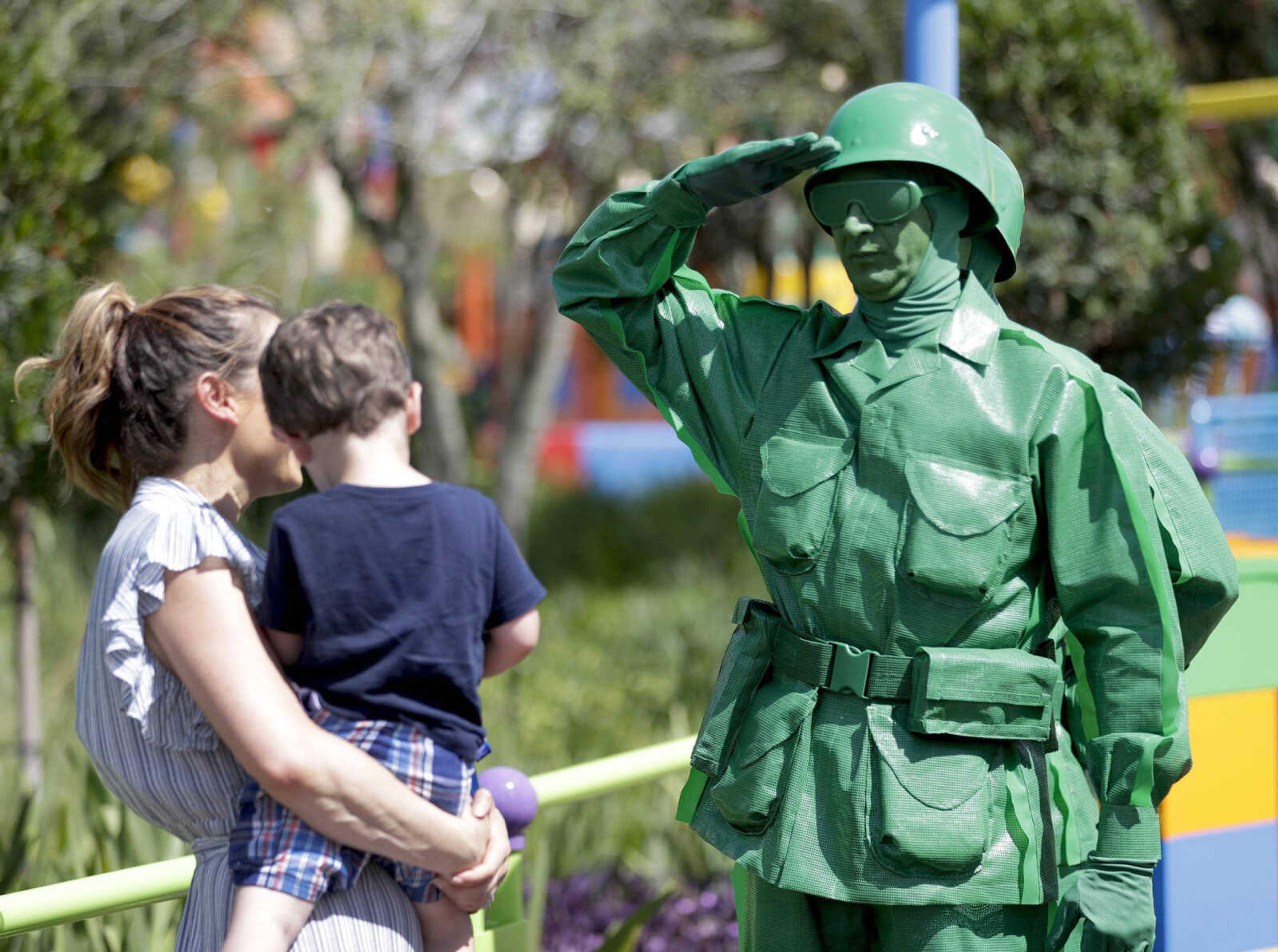 A Green Army man interacts with guests Saturday at Toy Story Land in Disney's Hollywood Studios at Walt Disney World in Lake Buena Vista, Florida.