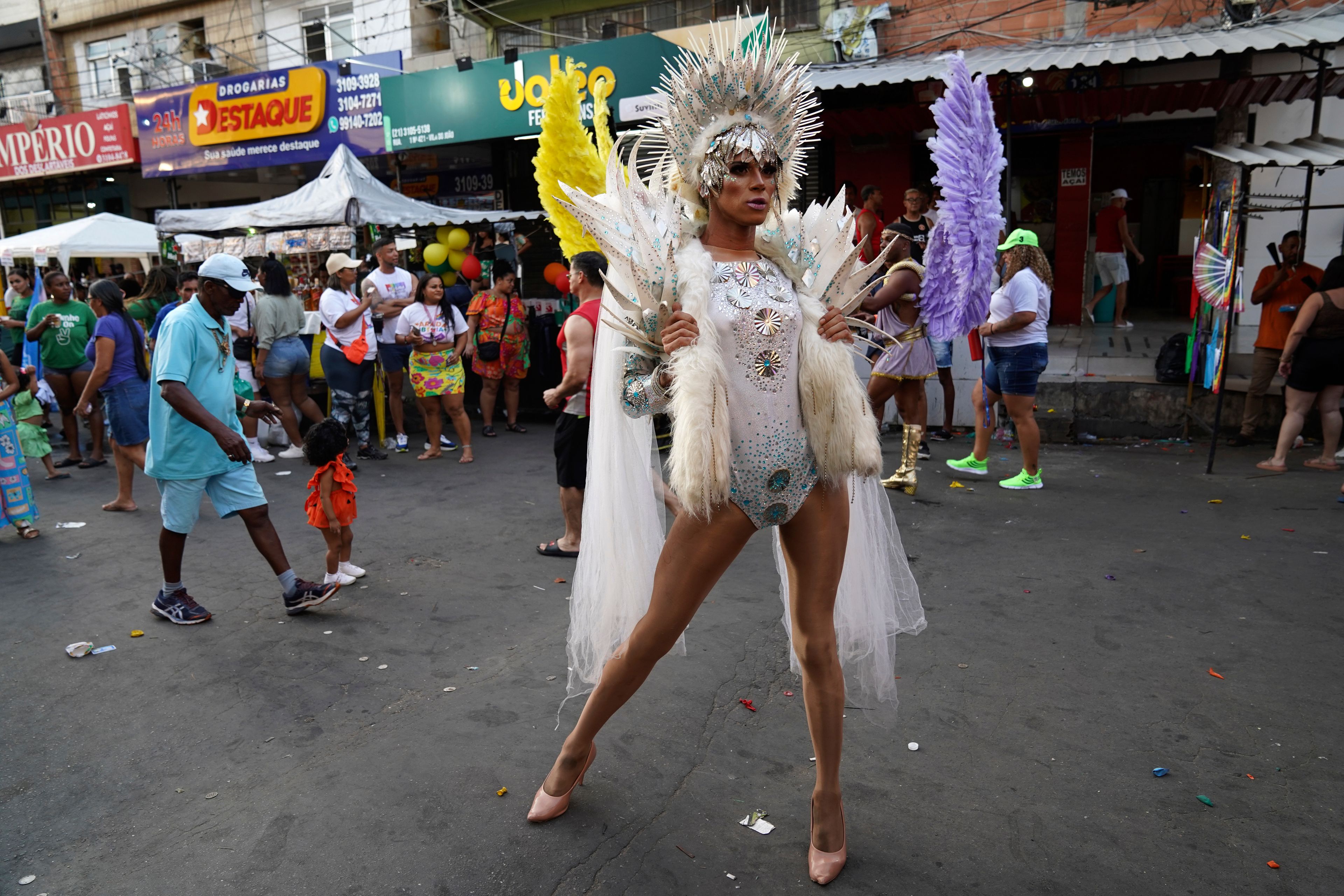 A participant in a costume poses for a portrait at an LGBTQIA+ pride parade in the Mare neighborhood of Rio de Janeiro, Sunday, Sept. 29, 2024. (AP Photo/Hannah-Kathryn Valles)