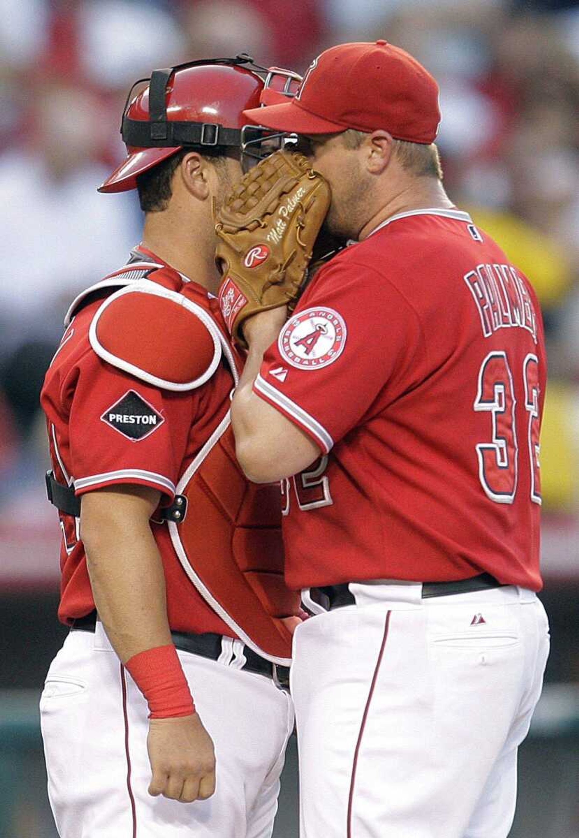 Angels starting pitcher Matt Palmer, right, talks to catcher Mike Napoli during Monday's game in Anaheim, Calif. (JAE HONG ~ Associated Press)