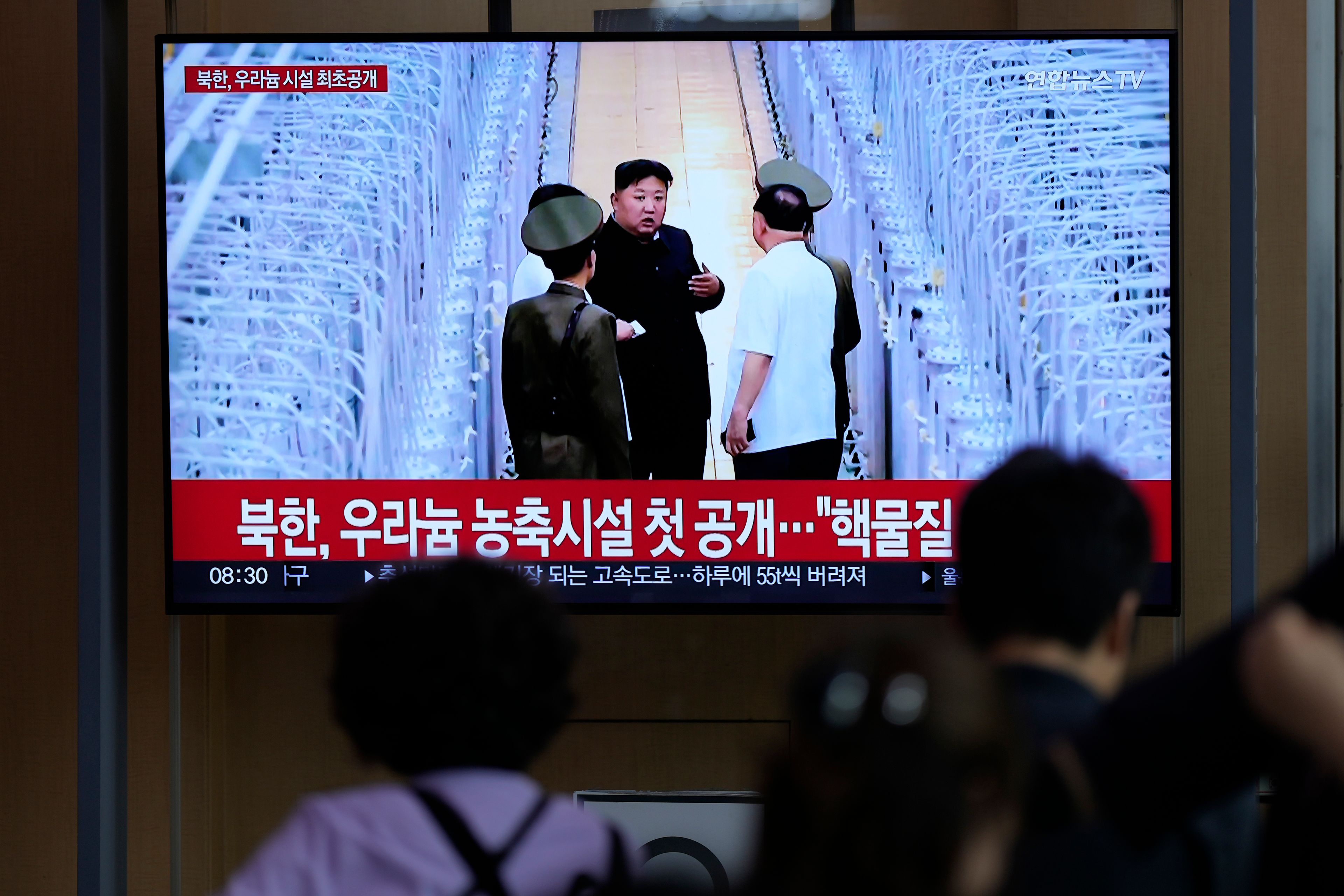 A TV screen shows an image of North Korean leader Kim Jong Un during a news program at the Seoul Railway Station in Seoul, South Korea, Friday, Sept. 13, 2024. The letters read, "North Korea, unveiling the uranium enrichment facility for the first time." (AP Photo/Lee Jin-man)