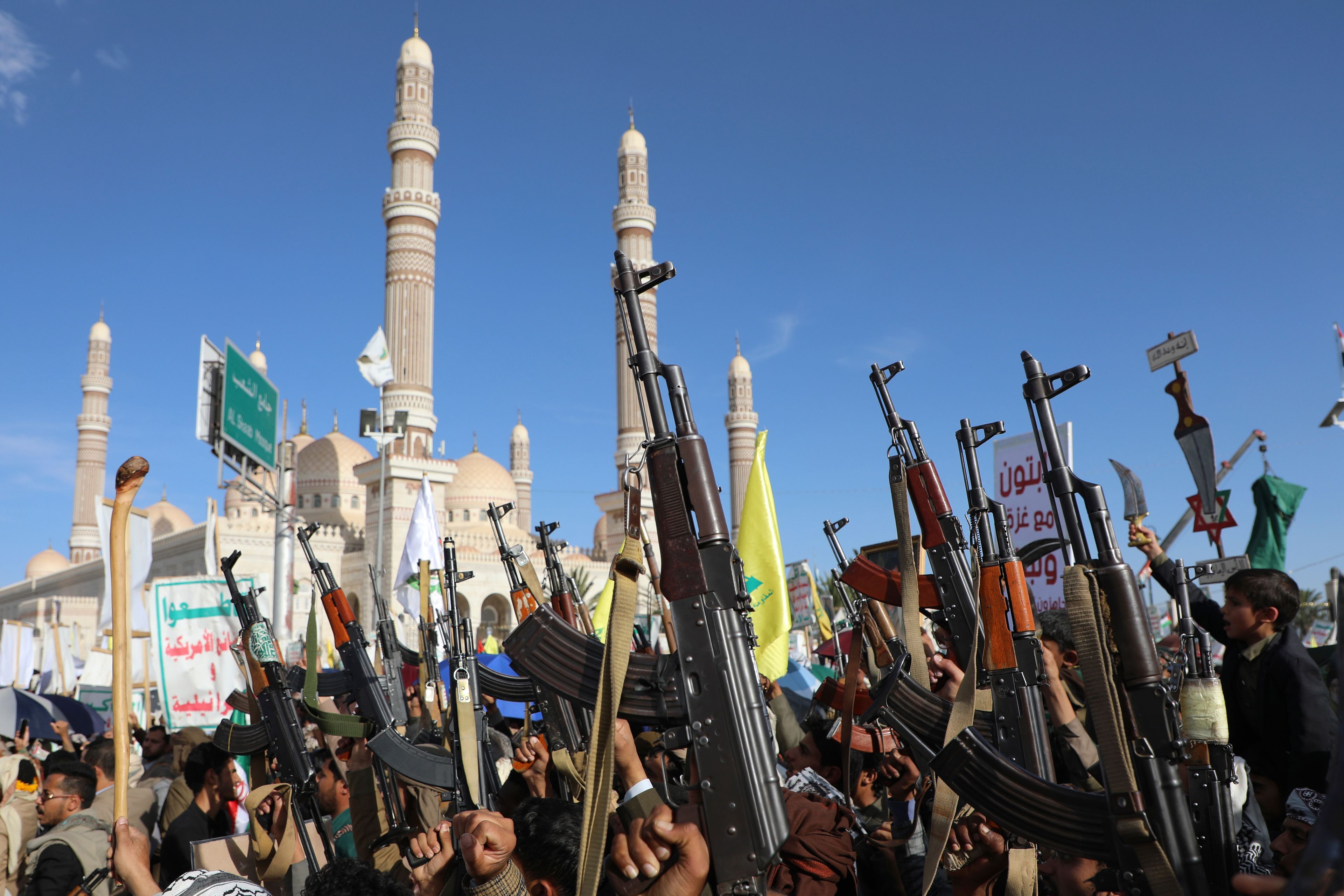 Houthi supporters raise their machine guns during an Anti- U.S and Israel rally in Sanaa, Yemen, Friday, Nov. 1, 2024. (AP Photo/Osamah Abdulrahman)