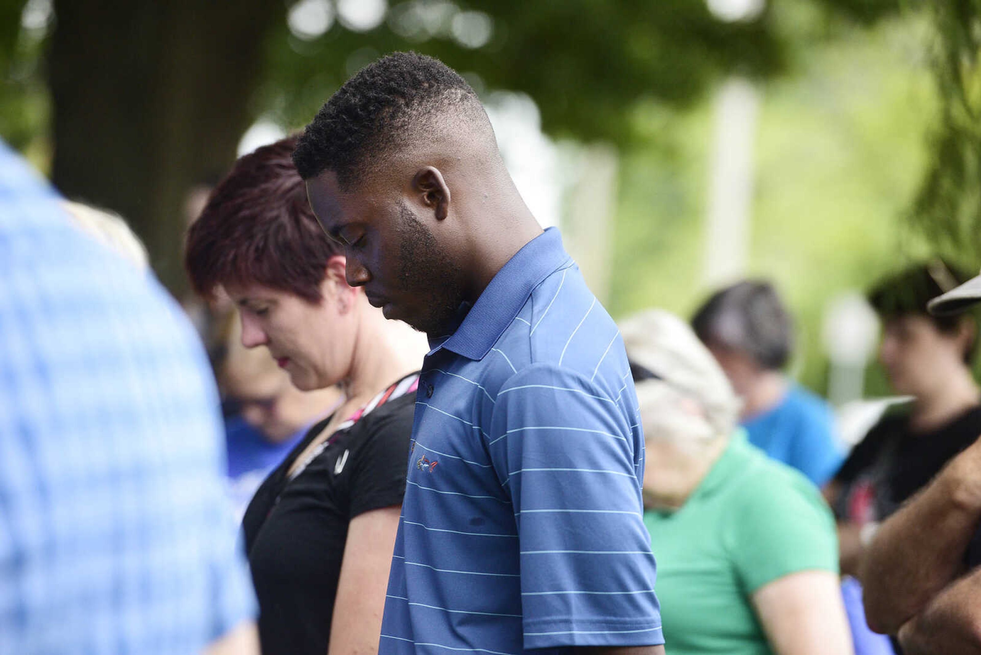 People gather for the Love, Not Hate rally on Sunday evening, Aug. 13, 2017, at Ivers Square in Cape Girardeau.