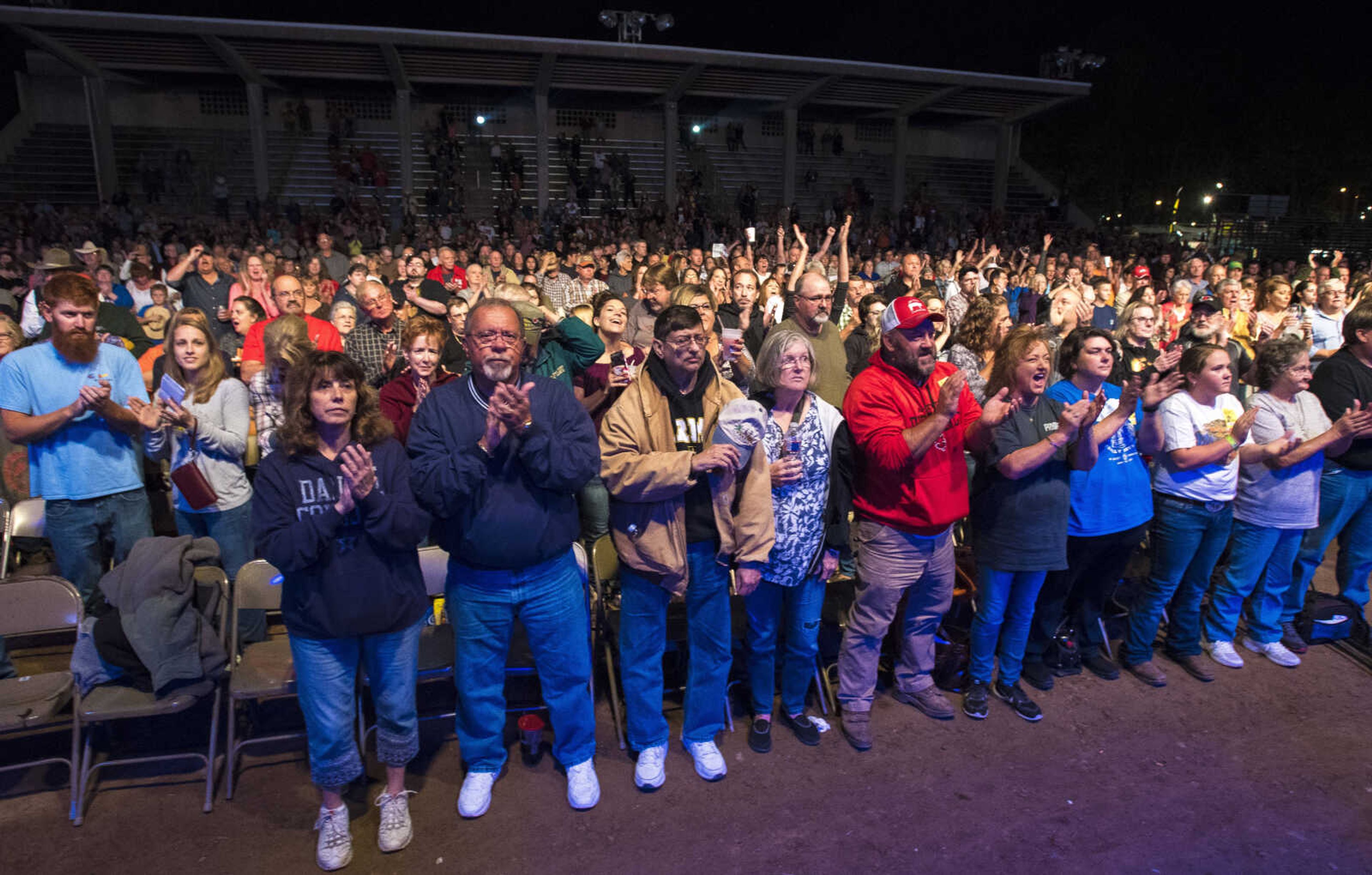 The crowd applauds after the playing of the national anthem before Charlie Daniels Band in the Arena Grandstand during the SEMO District Fair Wednesday, Sept. 13, 2017 at Arena Park in Cape Girardeau.