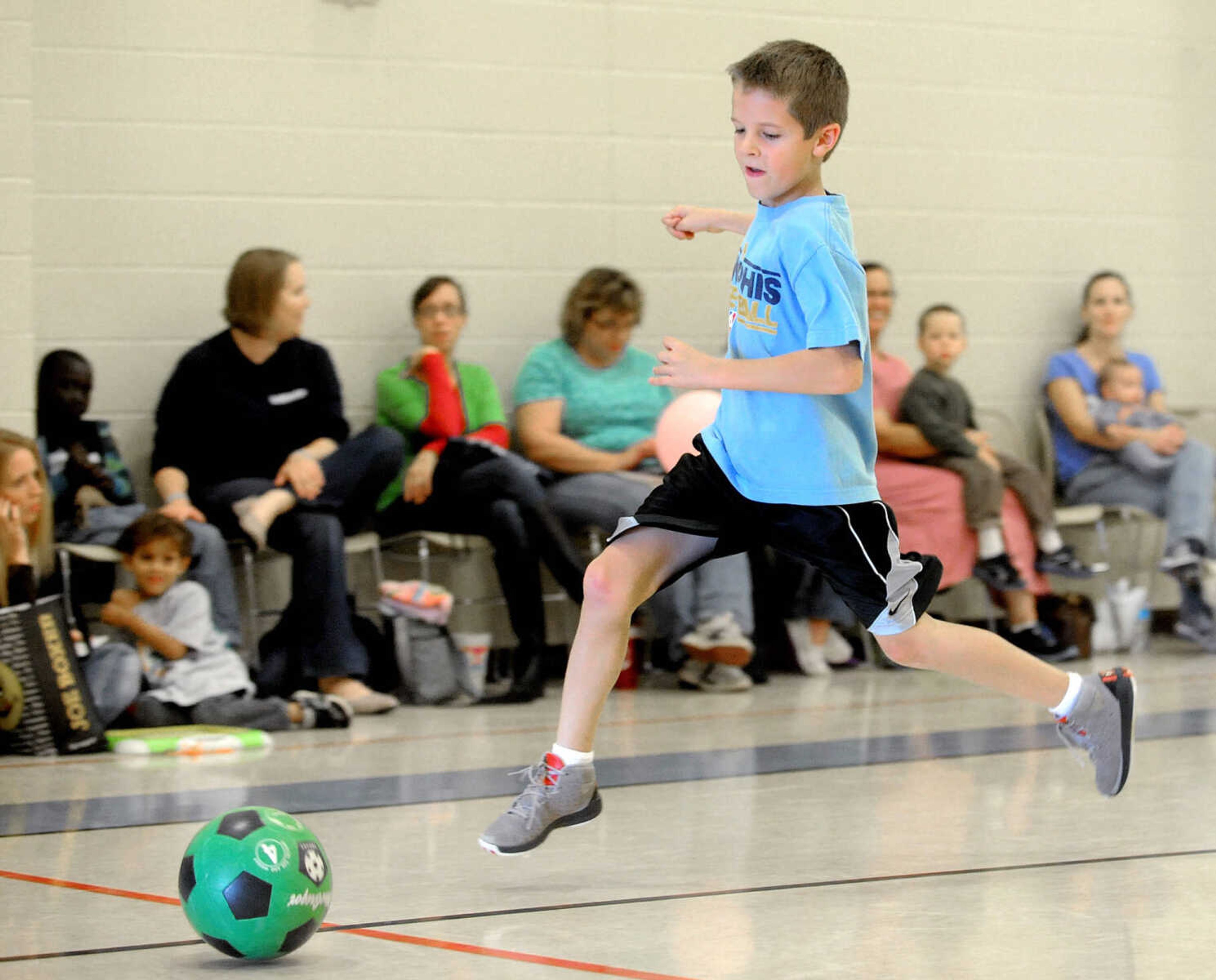 LAURA SIMON ~ lsimon@semissourian.com

Andrew Greene dribbles the ball while playing sideline soccer, Friday, Nov. 1, 2013, during his homeschool physical education class at Shawnee Park Center in Cape Girardeau.