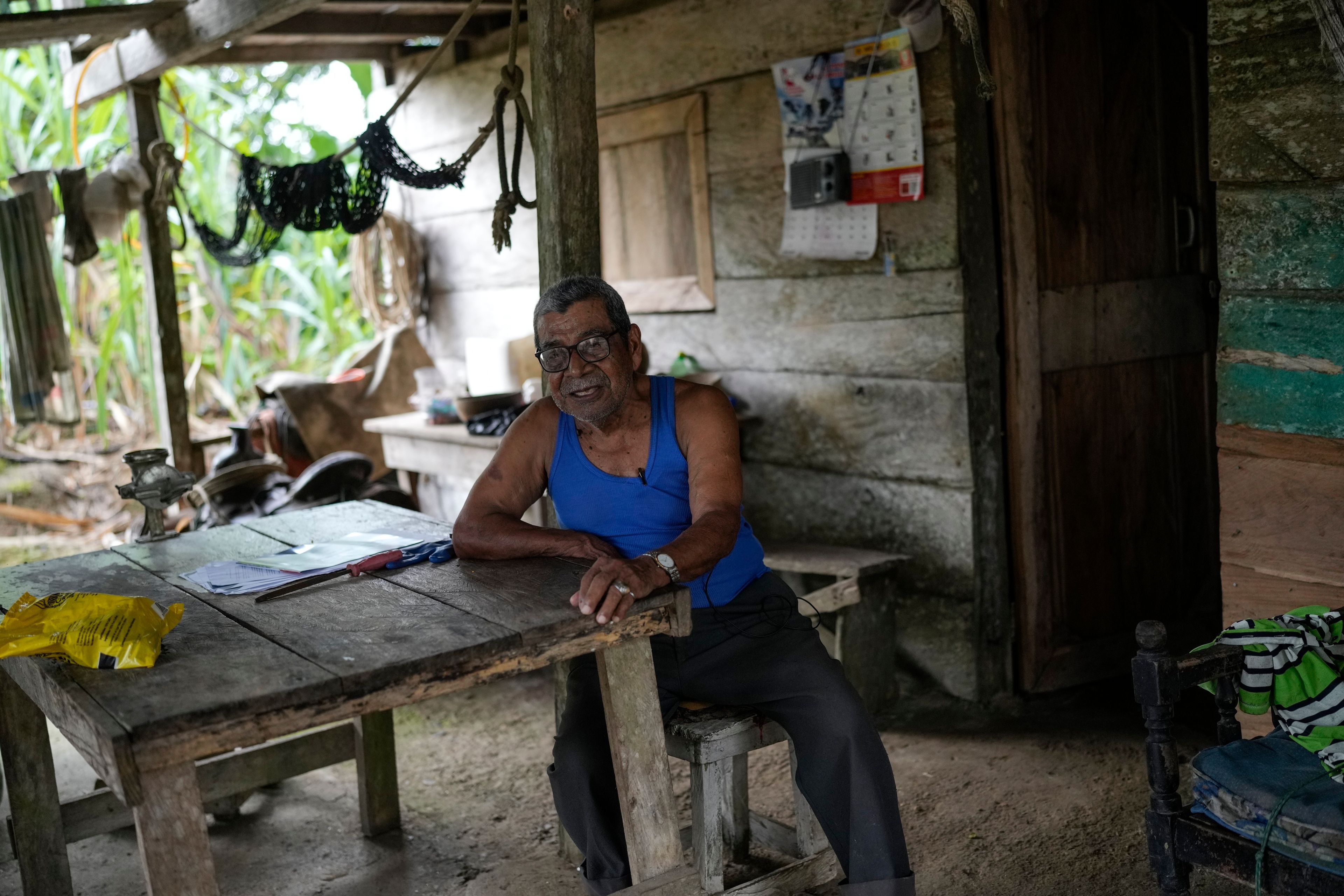 Olegario Hernandez gives an interview at his home in Limon, Panama, Saturday, Aug. 31, 2024. Limon could be submerged in a proposed plan to dam the nearby Indio River to secure the Panama Canal’s uninterrupted operation. (AP Photo/Matias Delacroix)