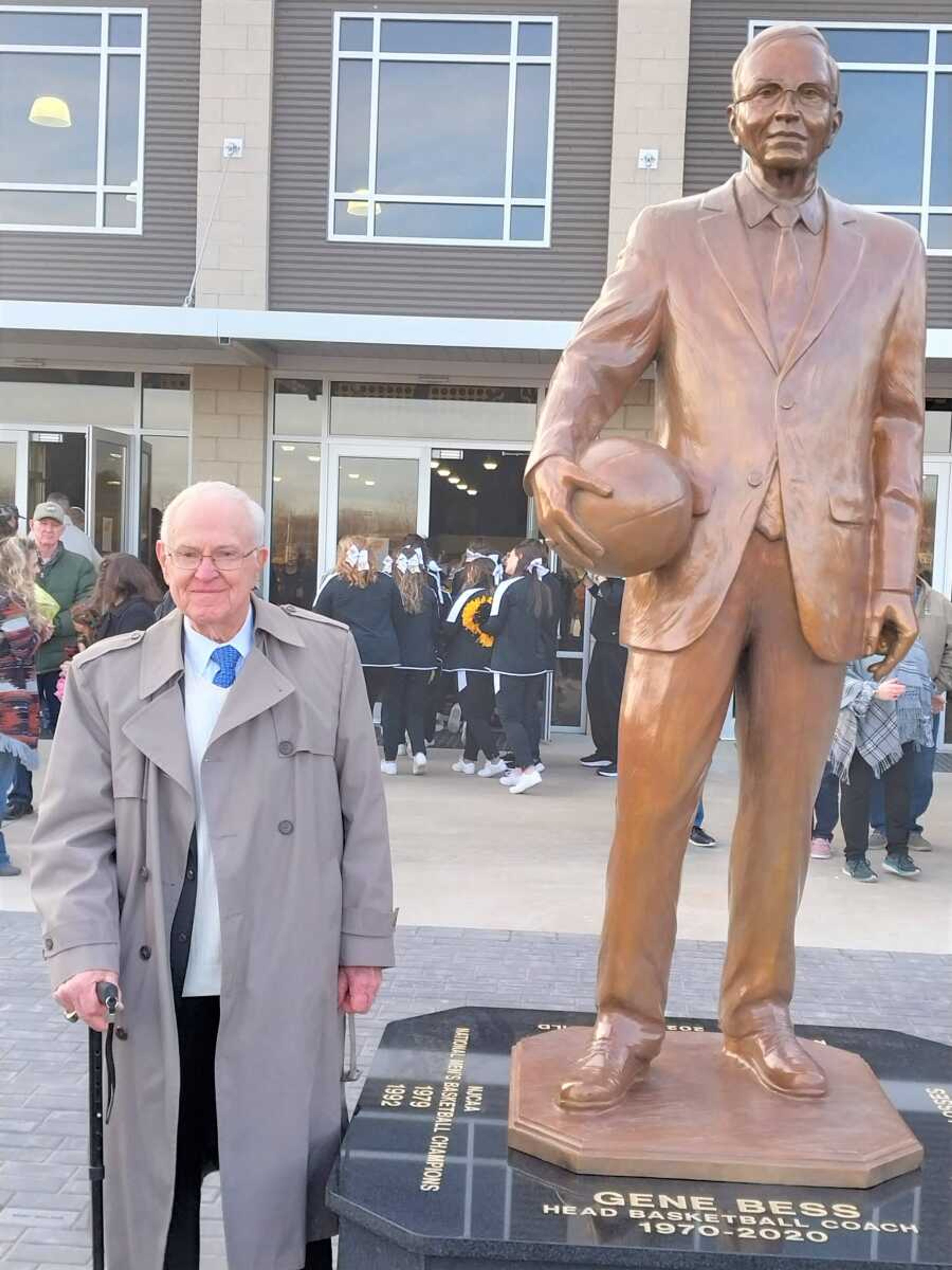 The real Gene Bess stands next to the statue unveiled in front of the Three Rivers College Libla Family Sports Complex Saturday as the former Raiders coach was honored for his 50 years and 1,300 wins while the men's basketball team's head coach.