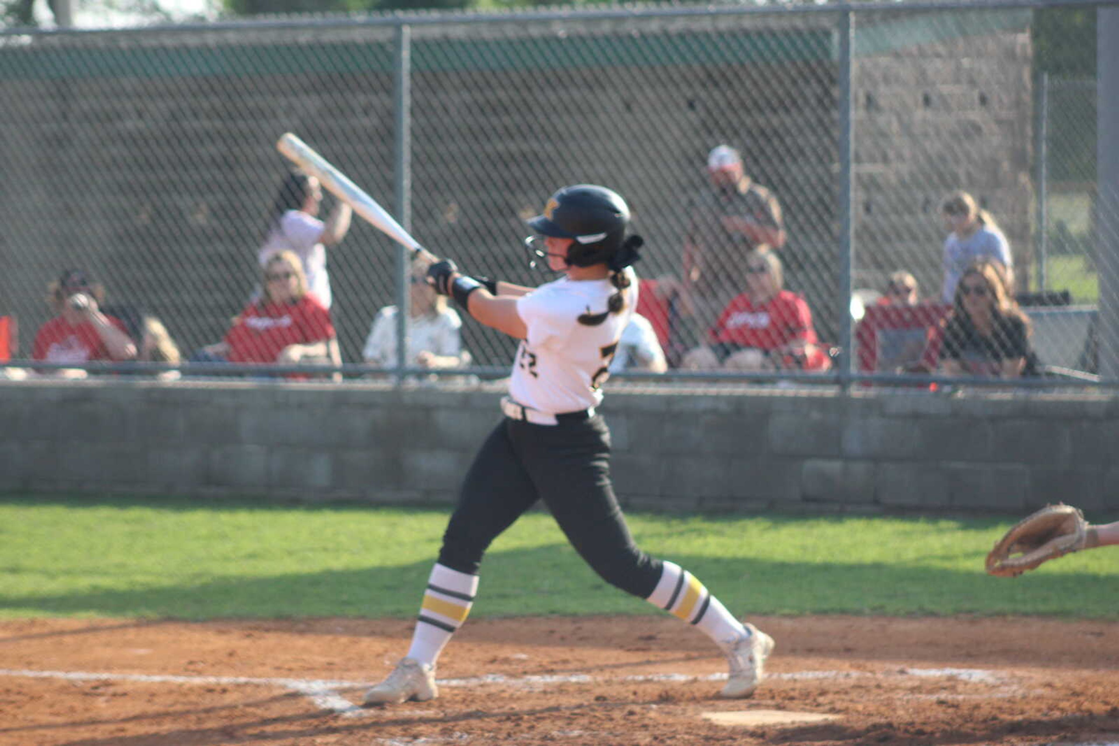 Kennett Lady Indians Lynnley Patterson clubs a ball Tuesday at Malden. 