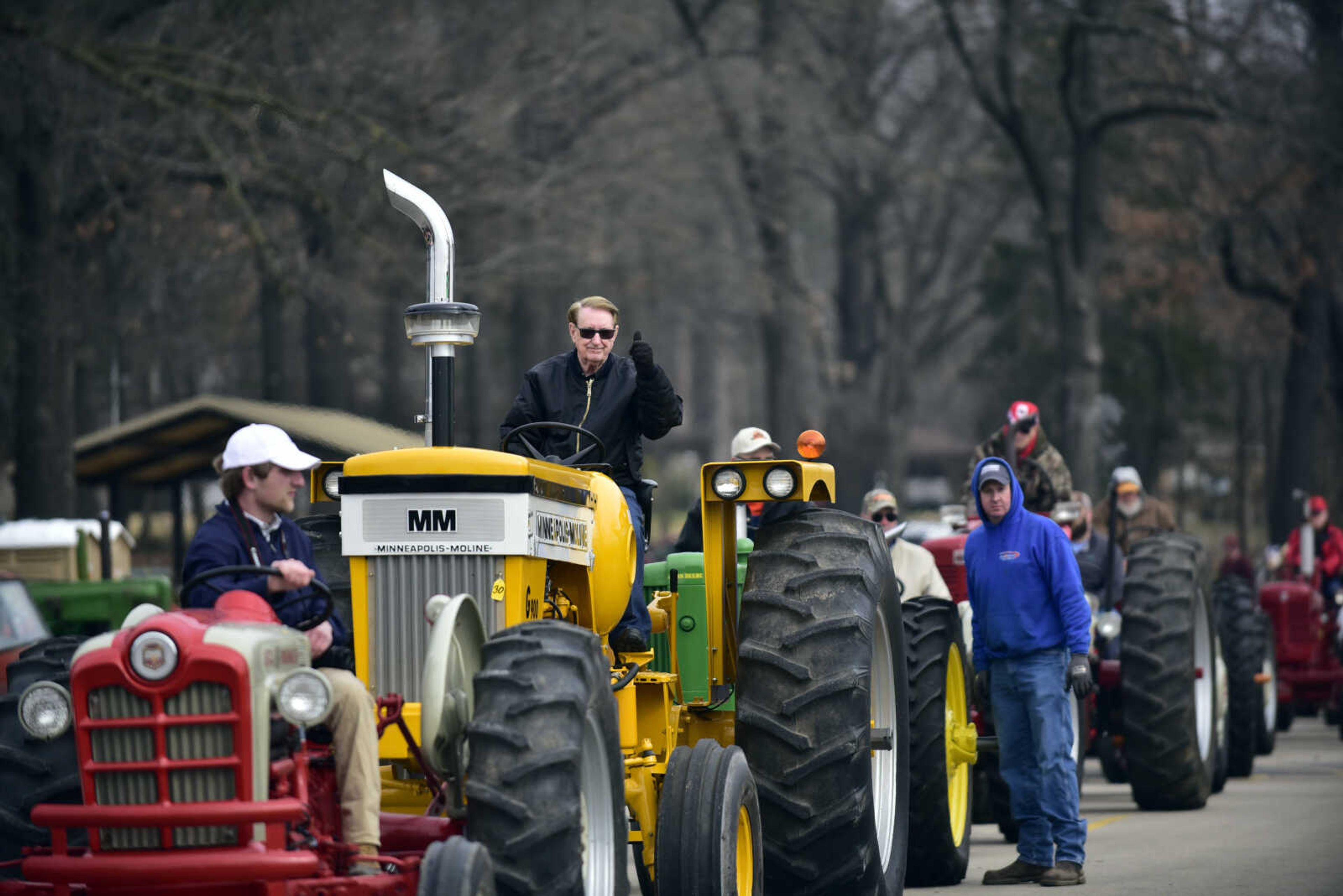 Cousin Carl gives a thumbs up from his tractor before the start of the tractor parade at the Cousin Carl Farm Show on Saturday, March 10, 2018, at Arena Park in Cape Girardeau.