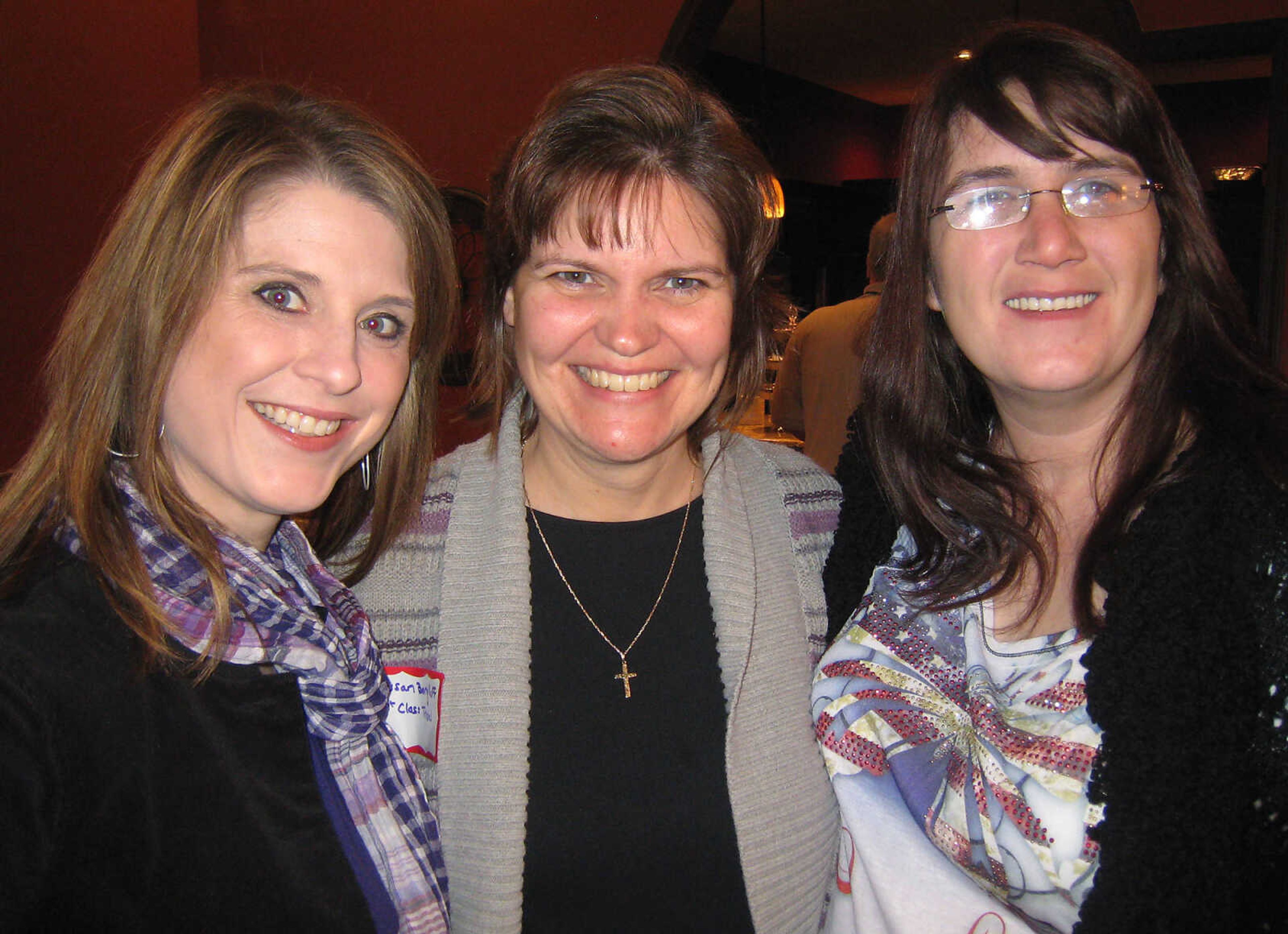 Sara Gerau, American Red Cross, left, Susan Berghoff, 1st Class Travel and Jennifer Morgan, 1st Class Travel at the Jackson Area Chamber of Commerce Business Breakfast, Feb. 15 at Creative Edge Inc. in Jackson.