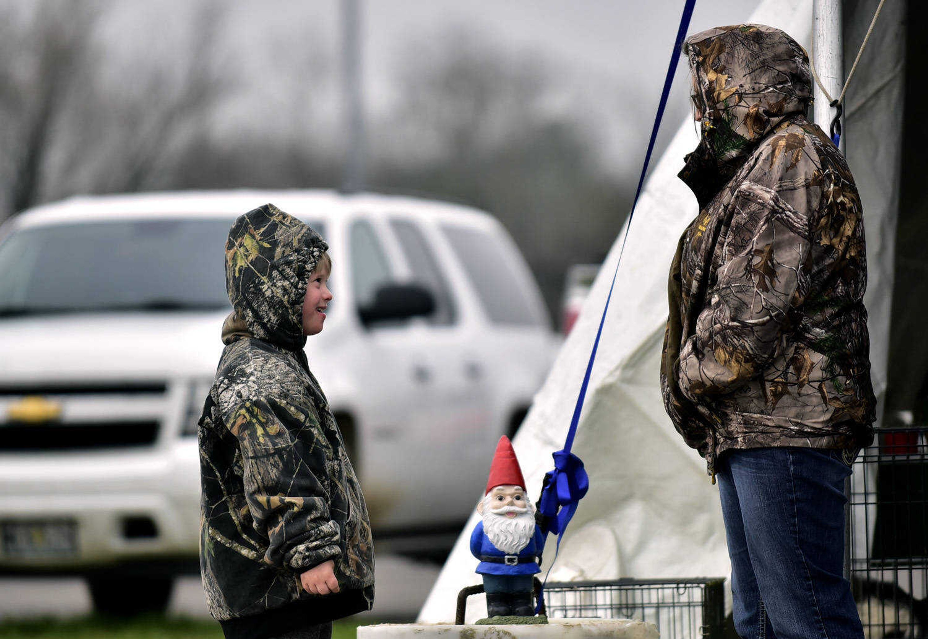 Caleb Wilkinson, 8, engages with Amanda Crites at the Cousin Carl Farm Show on Saturday, March 10, 2018, at Arena Park in Cape Girardeau.