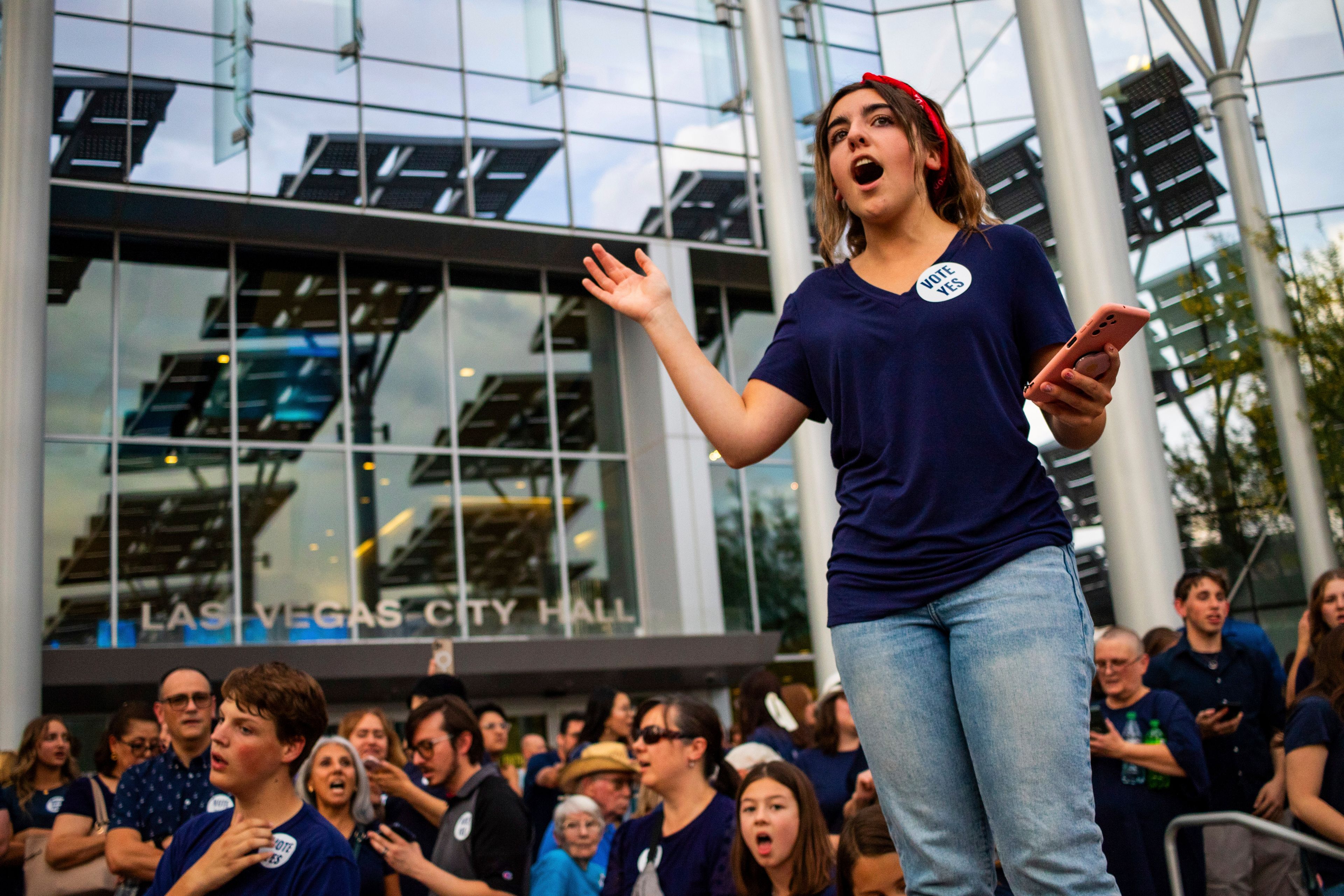 Members of The Church of Jesus Christ of Latter-day Saints sing outside Las Vegas City Hall as officials consider the church's plans to build a new temple near Las Vegas, May 14, 2024. (AP Photo/Ty ONeil)