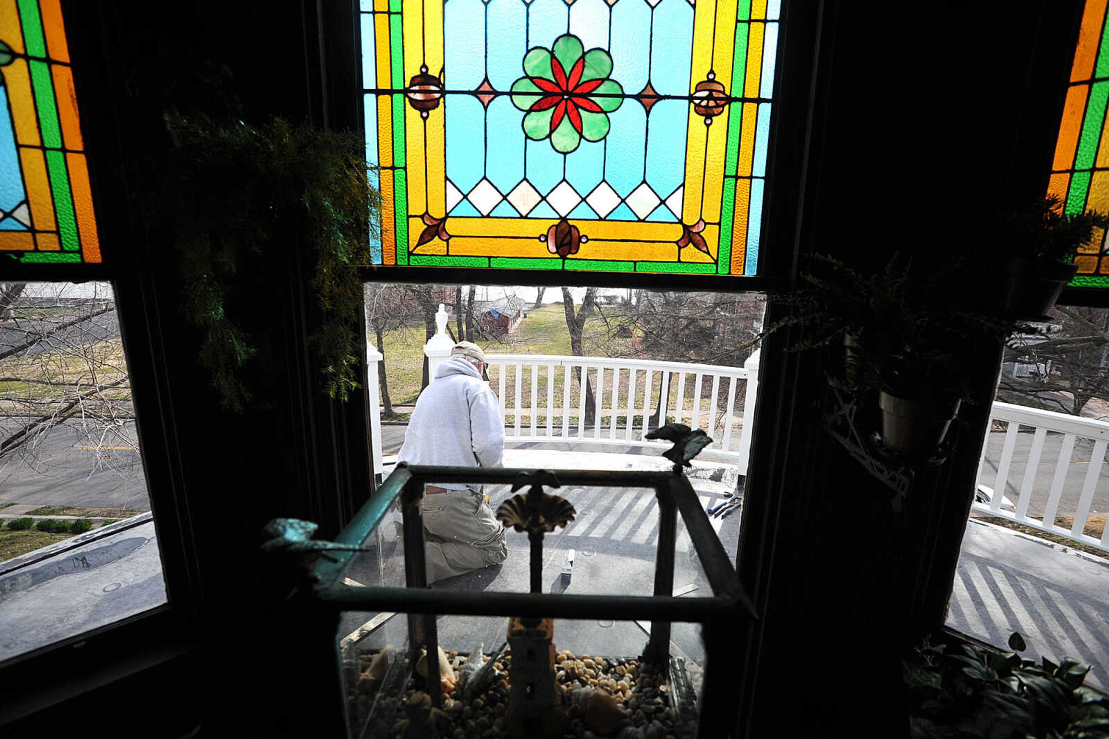 LAURA SIMON ~ lsimon@semissourian.com
Tony Parker works on the hand railing of the Glenn House's balcony Friday morning, March 15, 2013 in Cape Girardeau.