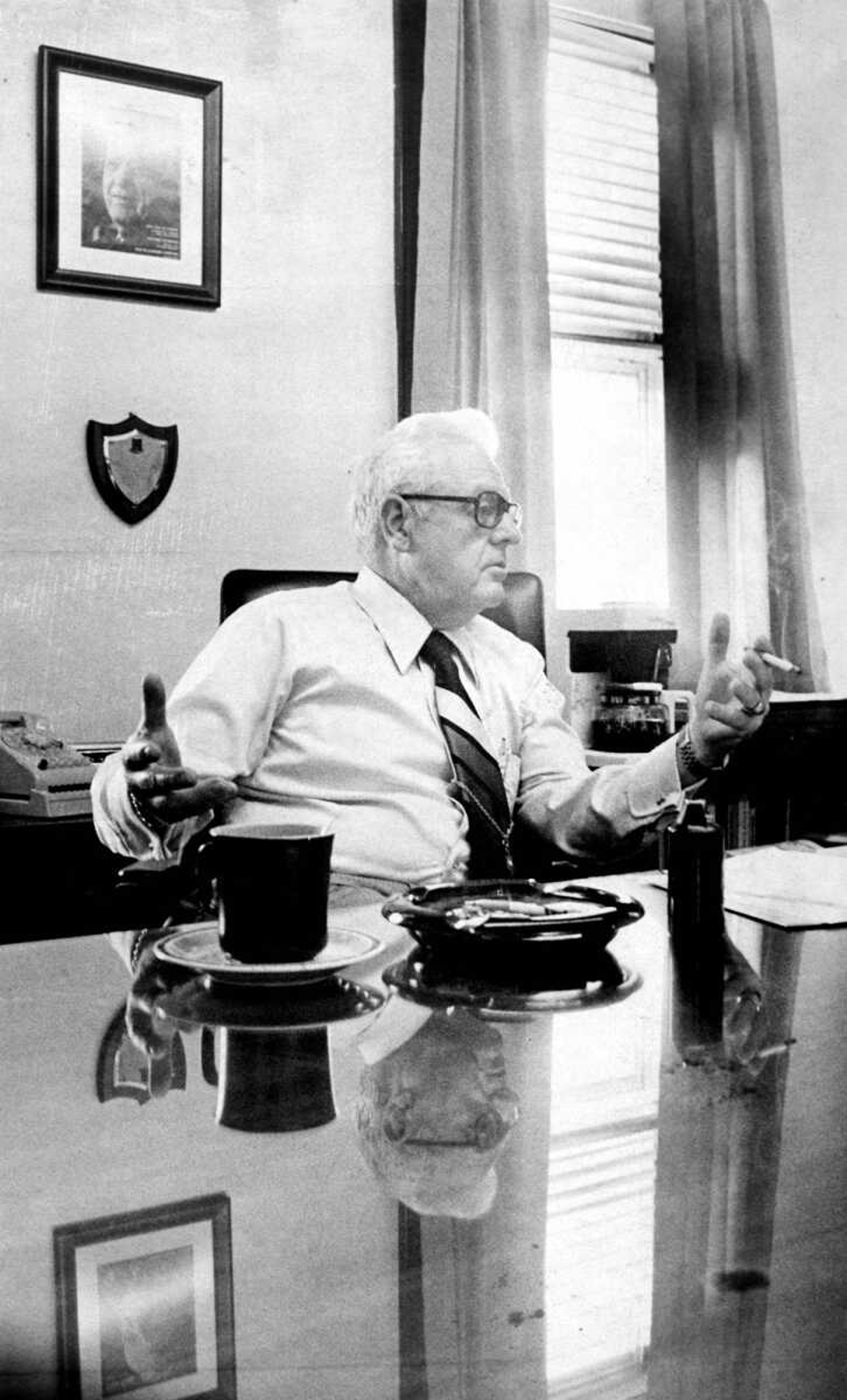 Henry H. Gerecke gestures as he emphasizes a point during an interview in his office Thursday with a Missourian reporter. The new police chief completes his first year of duty Saturday. (Dec. 19, 1975)