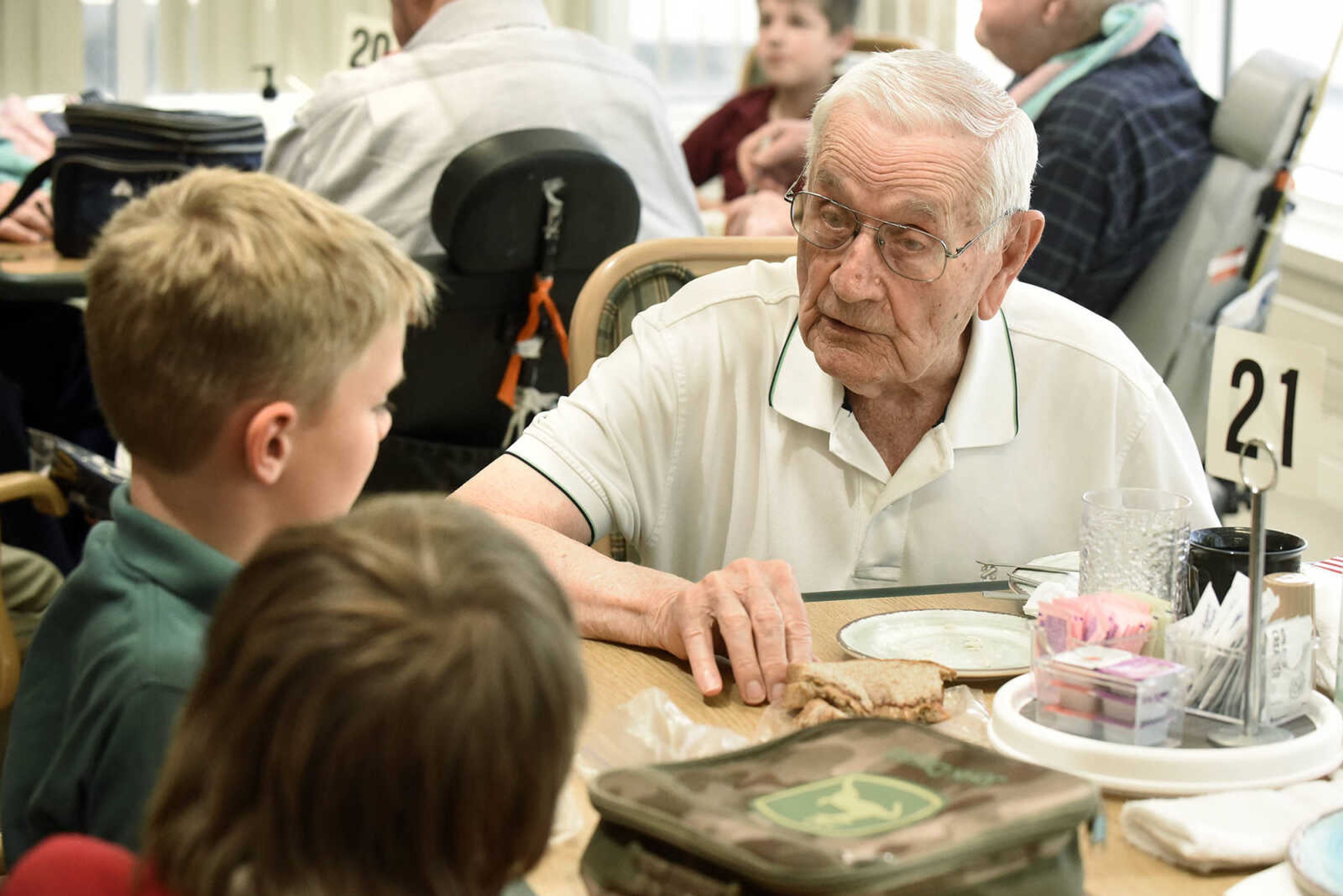 Delbert Wright chats with Prodigy Leadership Academy students, Andy Pederson, upper left, and Waylon Mulholland on Tuesday, April 25, 2017, at the Missouri Veterans Home in Cape Girardeau.