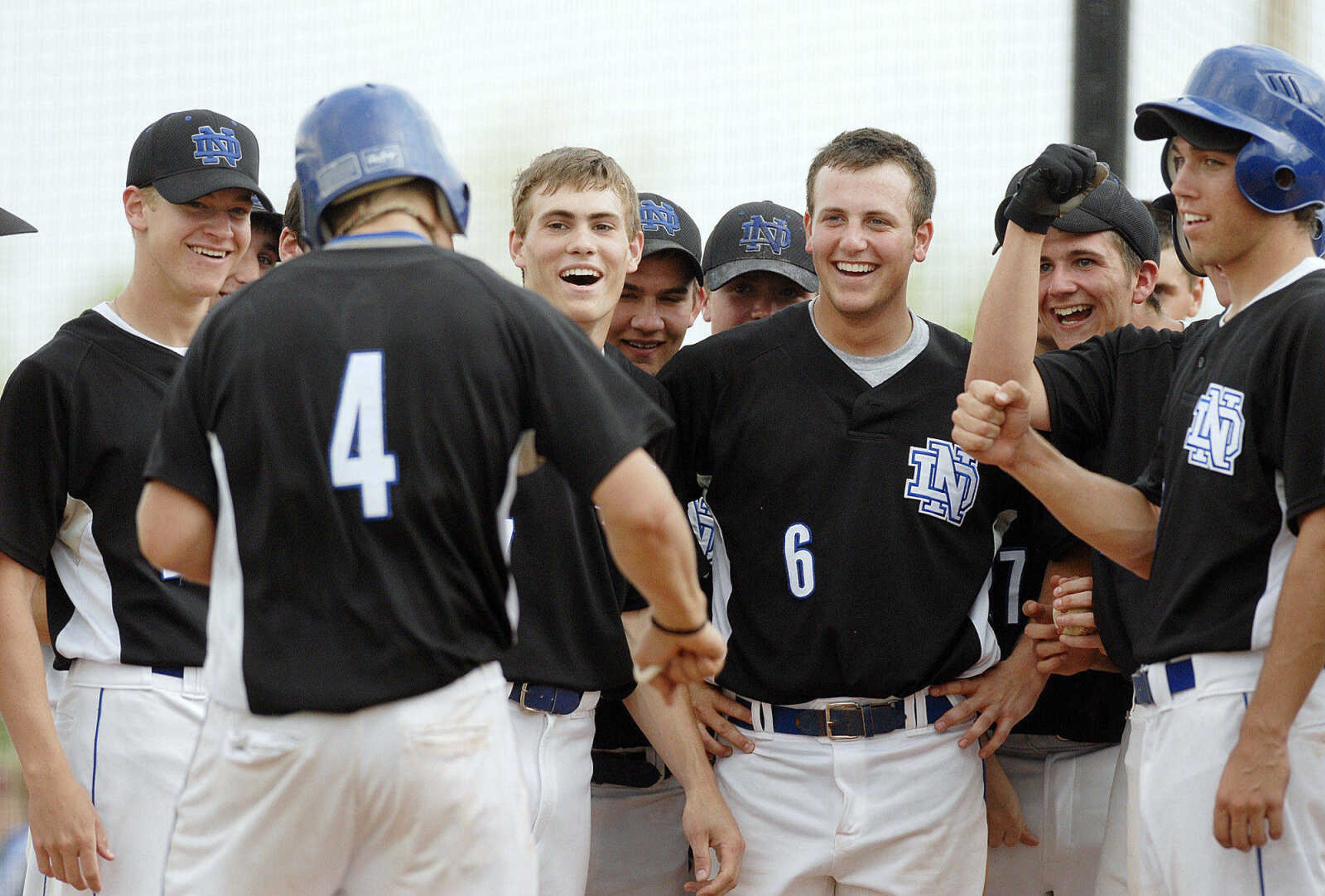 ELIZABETH DODD ~ edodd@semissourian.com
Notre Dame teammates congratulate Wesley Glaus on a two run homerun in the third inning against Jackson Wednesday at Notre Dame.