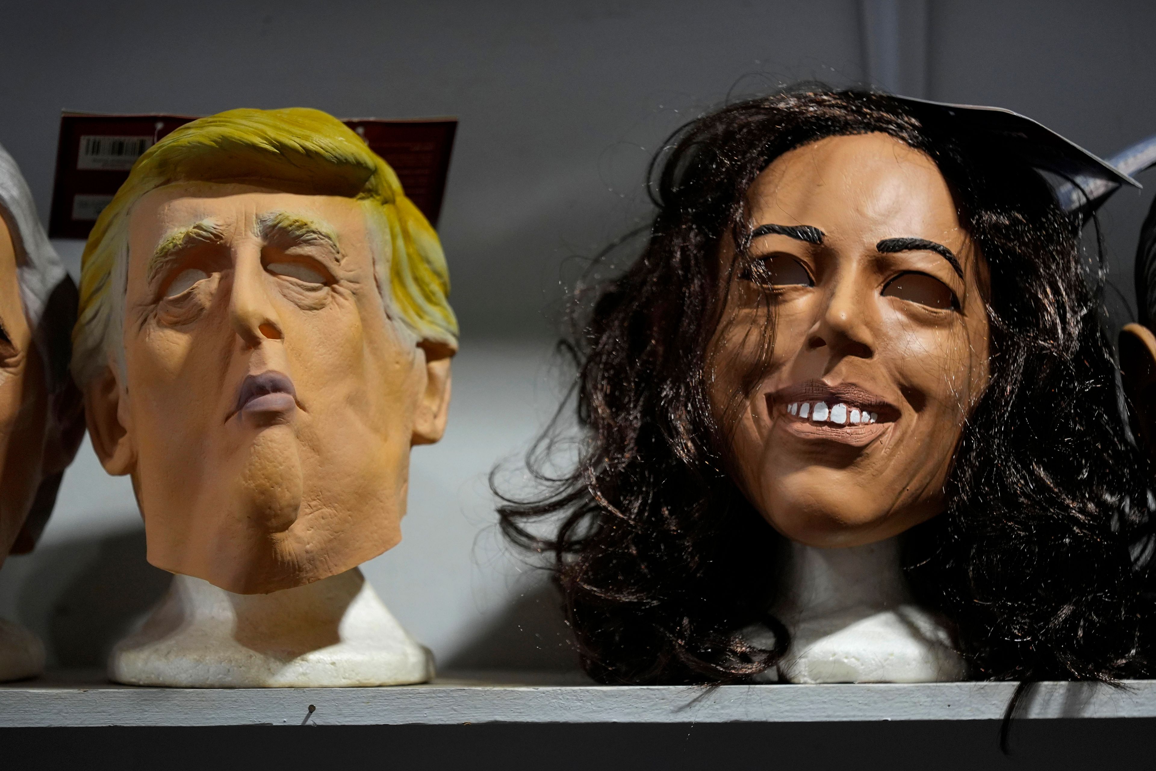 Masks of Republican presidential nominee former President Donald Trump and Democratic presidential nominee Vice President Kamala Harris are seen on display at The Theatrical Shop, Tuesday, Oct. 29, 2024, in West Des Moines, Iowa. (AP Photo/Charlie Neibergall)