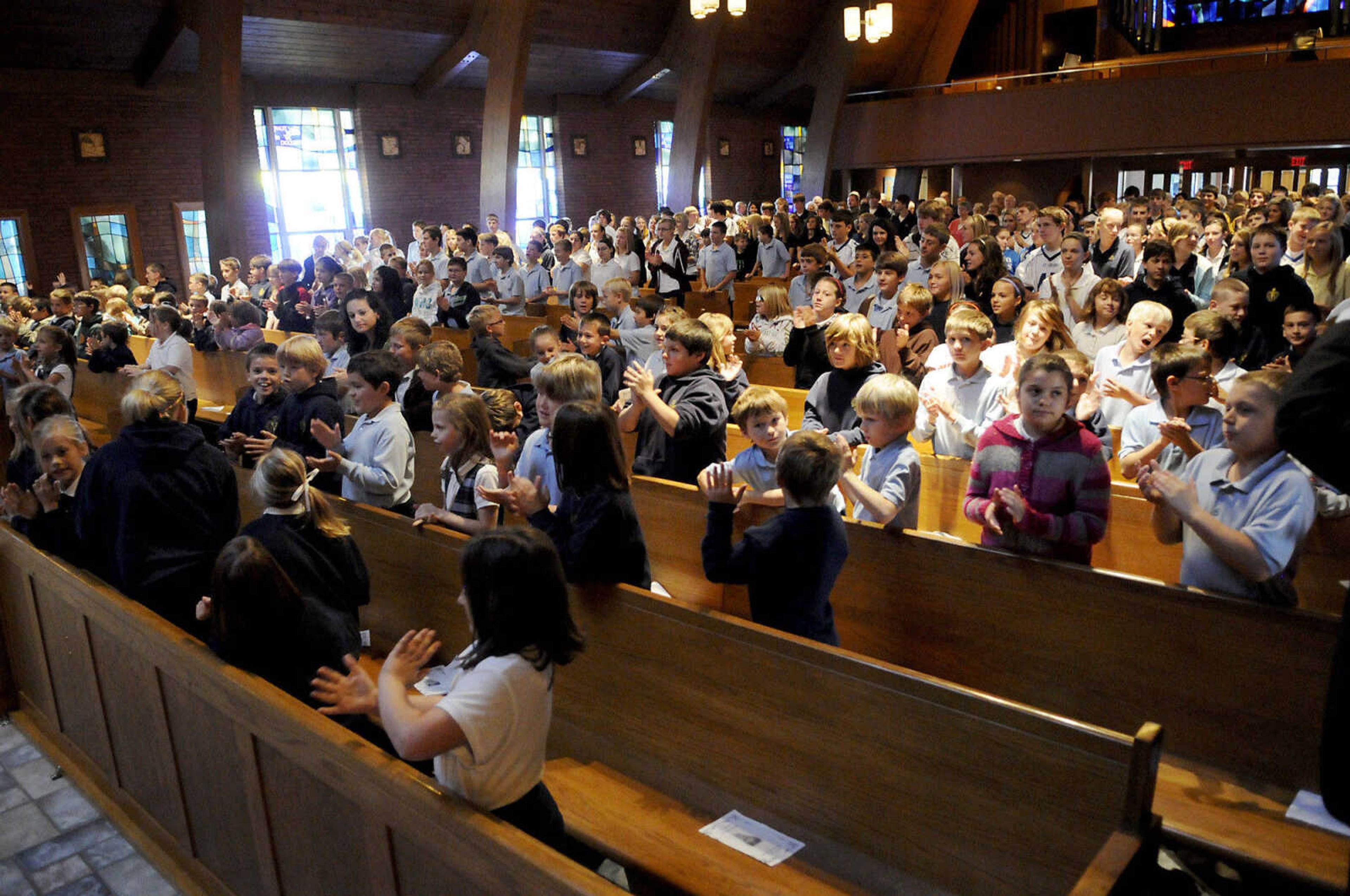 KRISTIN EBERTS ~ keberts@semissourian.com

St. Vincent students applaud as their teachers are recognized during Mass at St. Vincent De Paul parish in Perryville, Mo., on Friday, Oct. 15, 2010. The Mass was followed by an assembly to celebrate the school's recognition on the list of the best 50 Catholic secondary schools in America, presented by the Catholic High School Honor Roll. This is the first time St. Vincent has received this distinction.