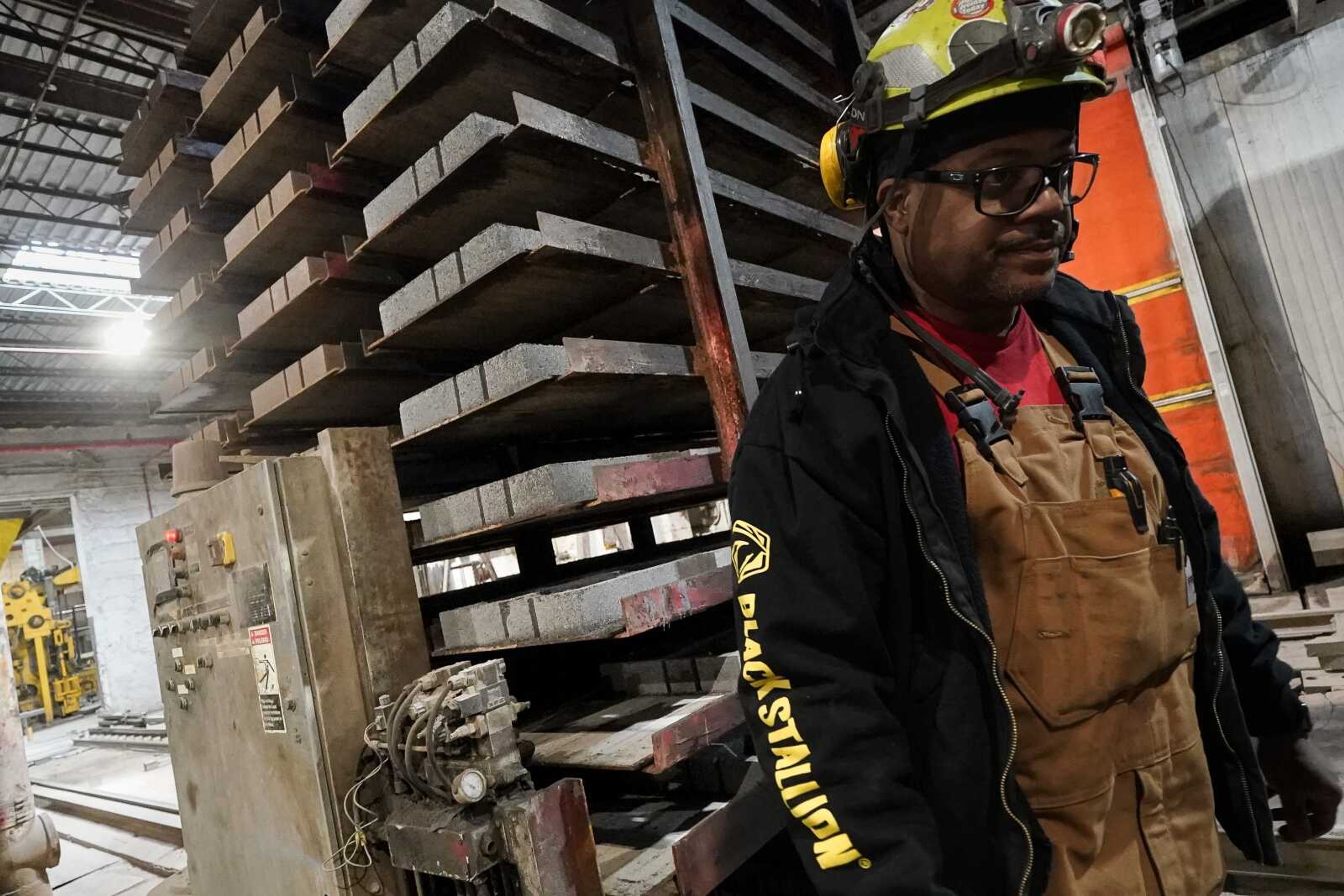 A stack of concrete blocks created with liquid carbon dioxide as an ingredient is pulled from a curing kiln at the Glenwood Mason Supply Co. on April 18 in the Brooklyn borough of New York.