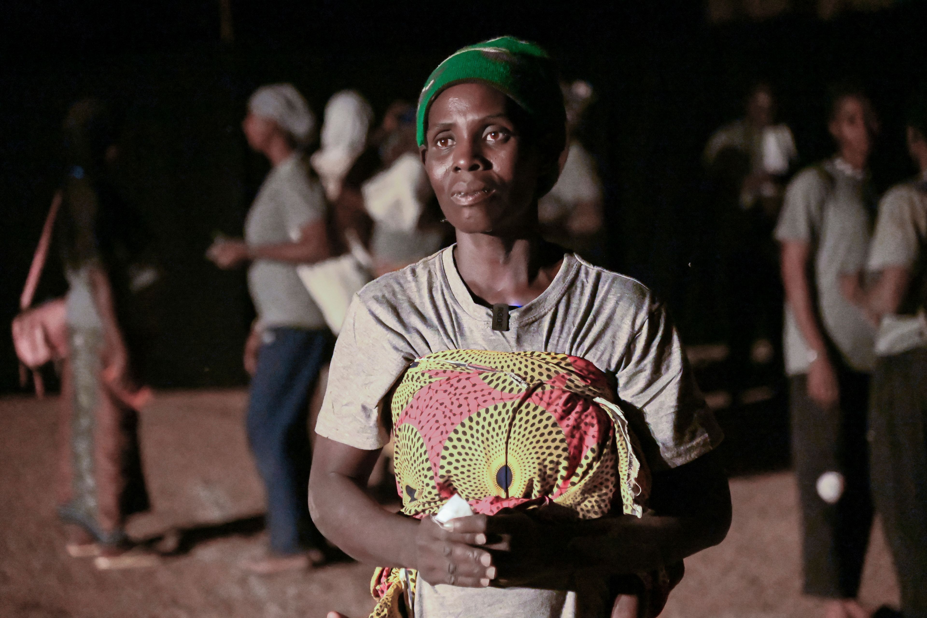 Fanta Charlotte Denbe, a mother of three who fled her village after it was attacked by extremists, participates in Recreatrales, an international theater festival held in Ouagadougou, Burkina Faso, Monday, Oct. 28, 2024. (AP Photo/Kilaye Bationo)