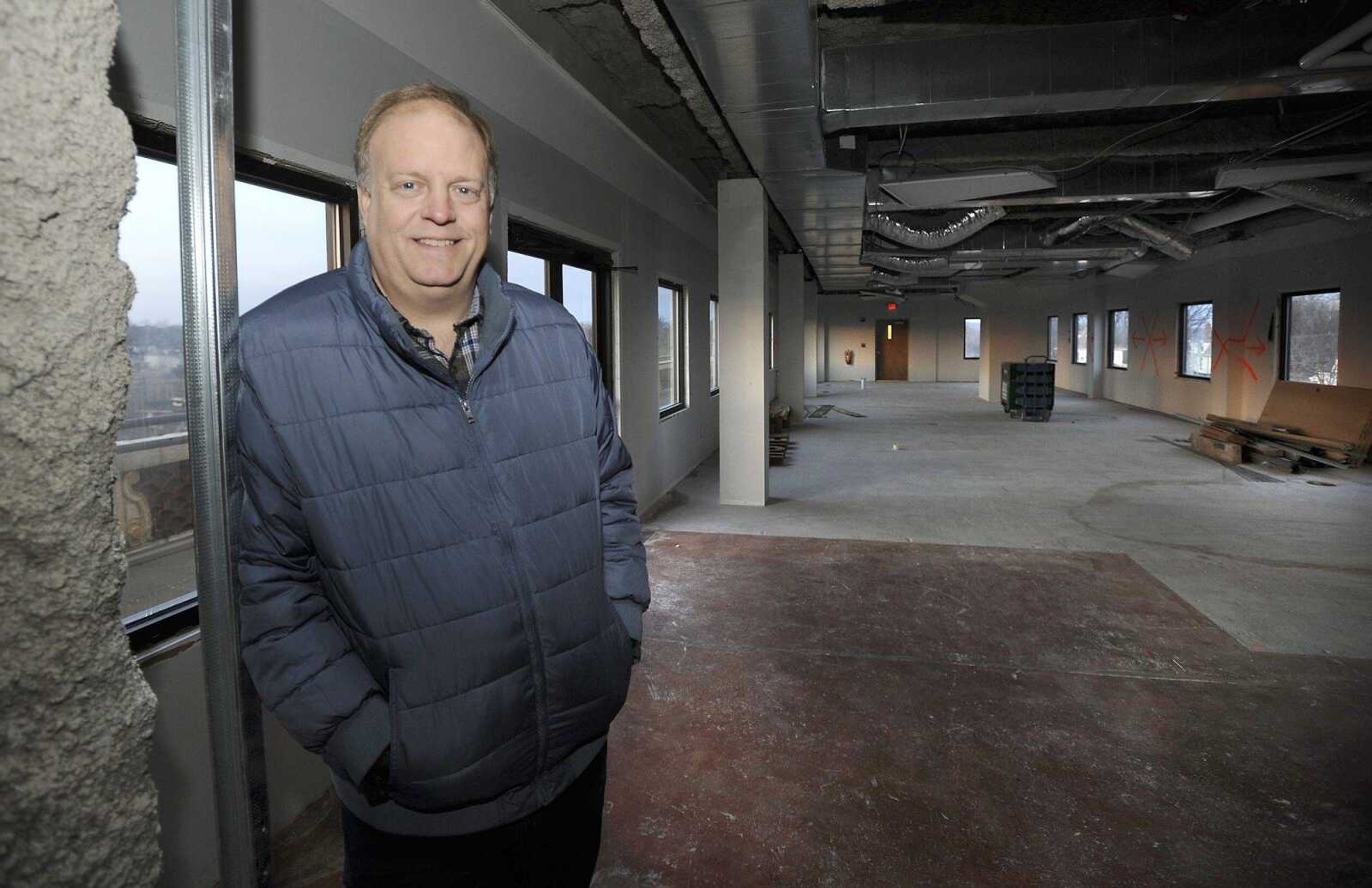 Keller Ford poses for a photo Friday in the space atop Marquette Tower where he will open a restaurant and bar.