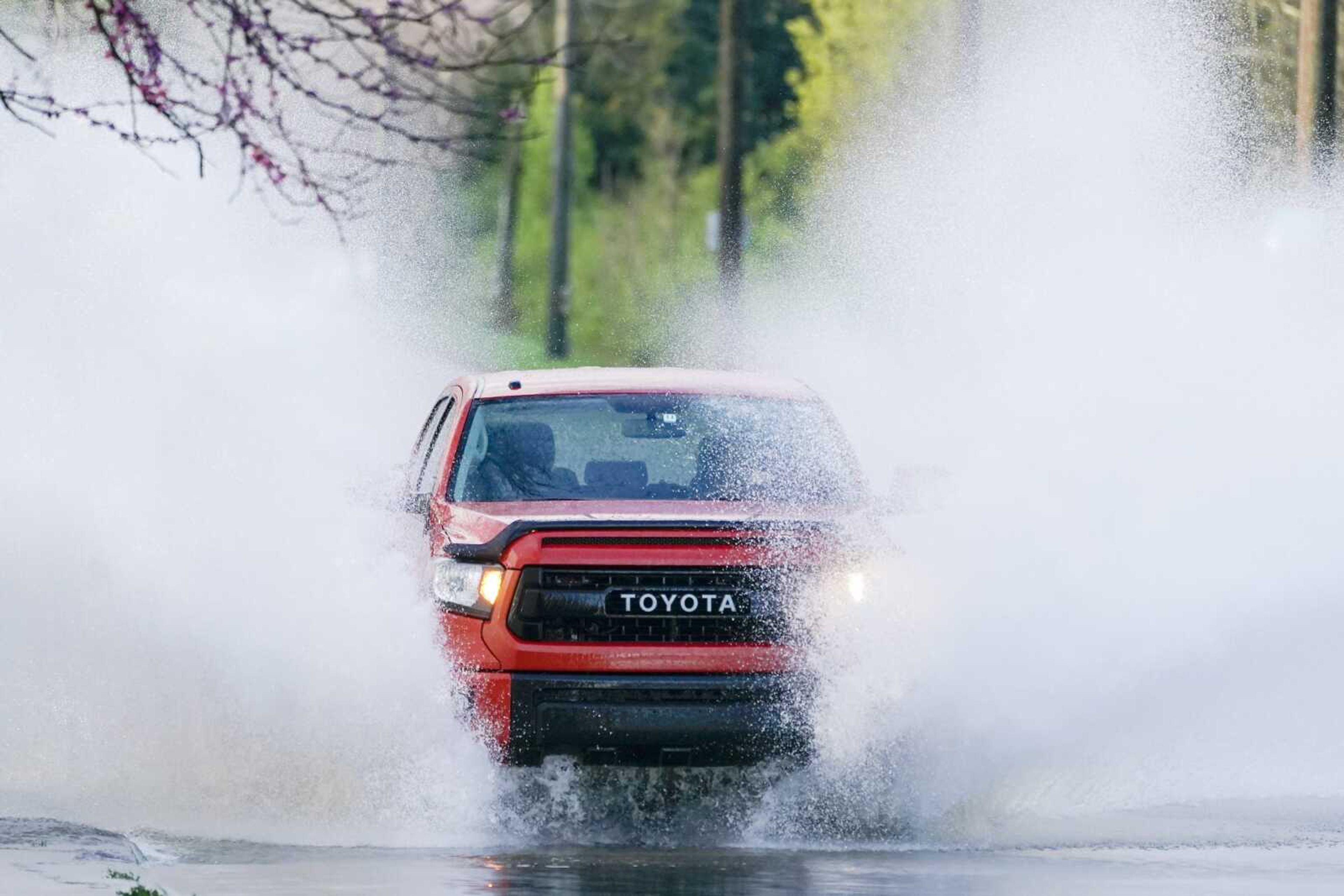 A truck drives through water on the road Sunday in Nashville, Tennessee.