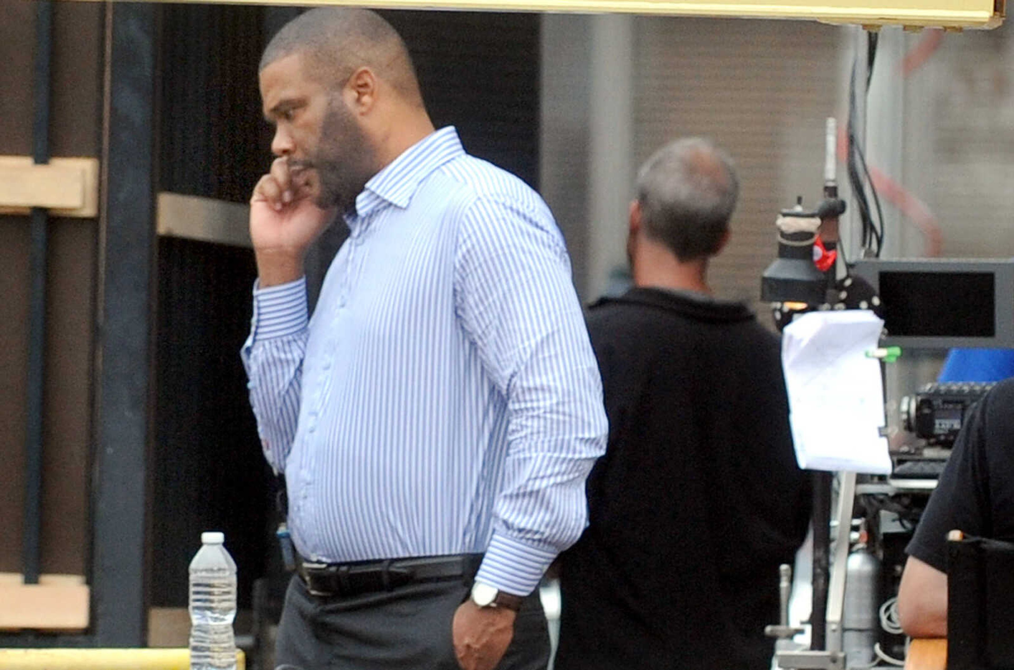 LAURA SIMON ~ lsimon@semissourian.com

Tyler Perry takes a break from filming a scene from 20th Century Fox's feature film "Gone Girl", Tuesday, Oct. 1, 2013, in Cape Girardeau.