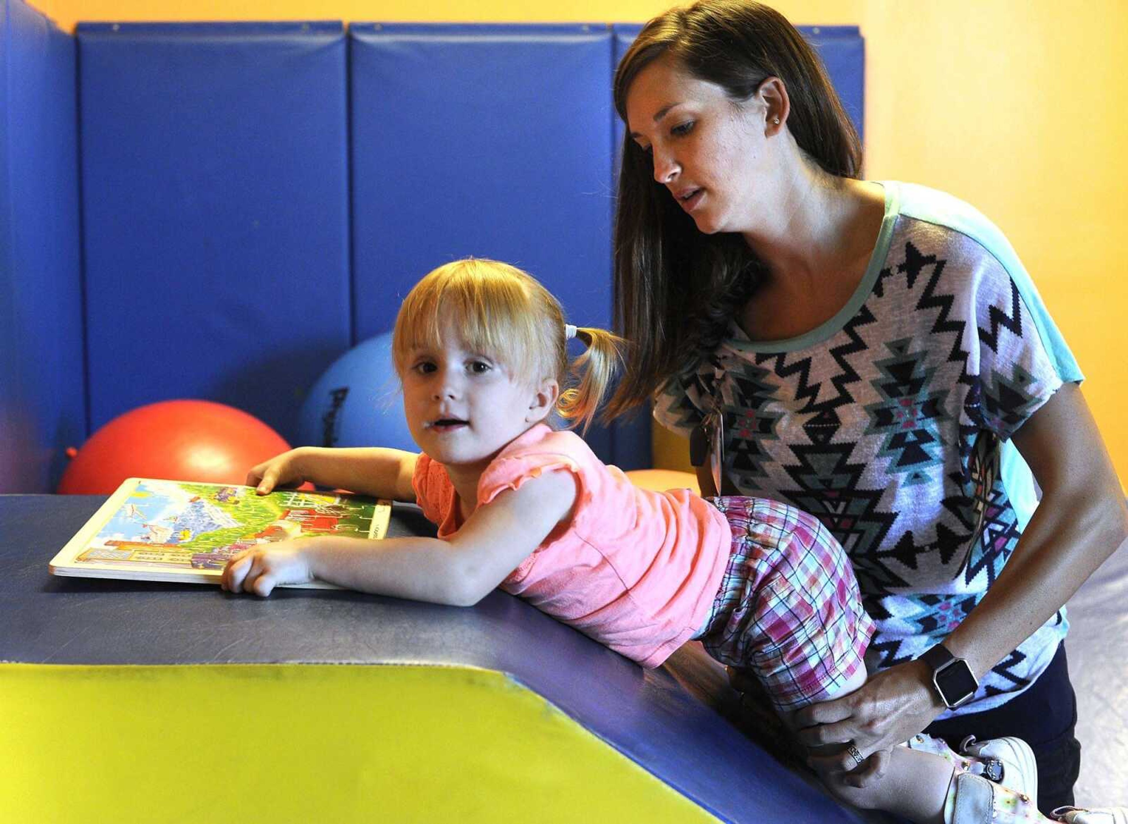 Jordyn Conn works with Malerie Essner, a physical therapist, Thursday, Aug. 11, 2016 at HealthPoint Rehabilitation in Cape Girardeau.