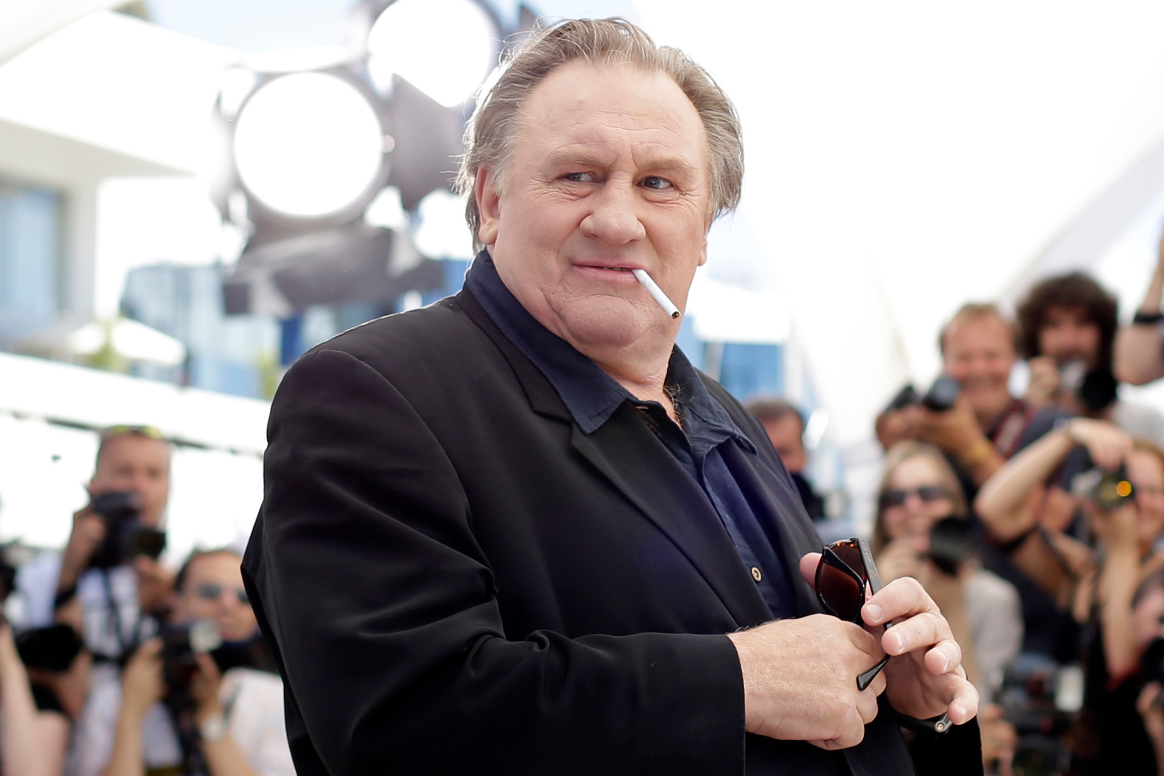 Actor Gerard Depardieu poses for photographers during a photo call for the film Valley of Love, at the 68th international film festival, Cannes, southern France, on May 22, 2015. (AP Photo/Thibault Camus, File)