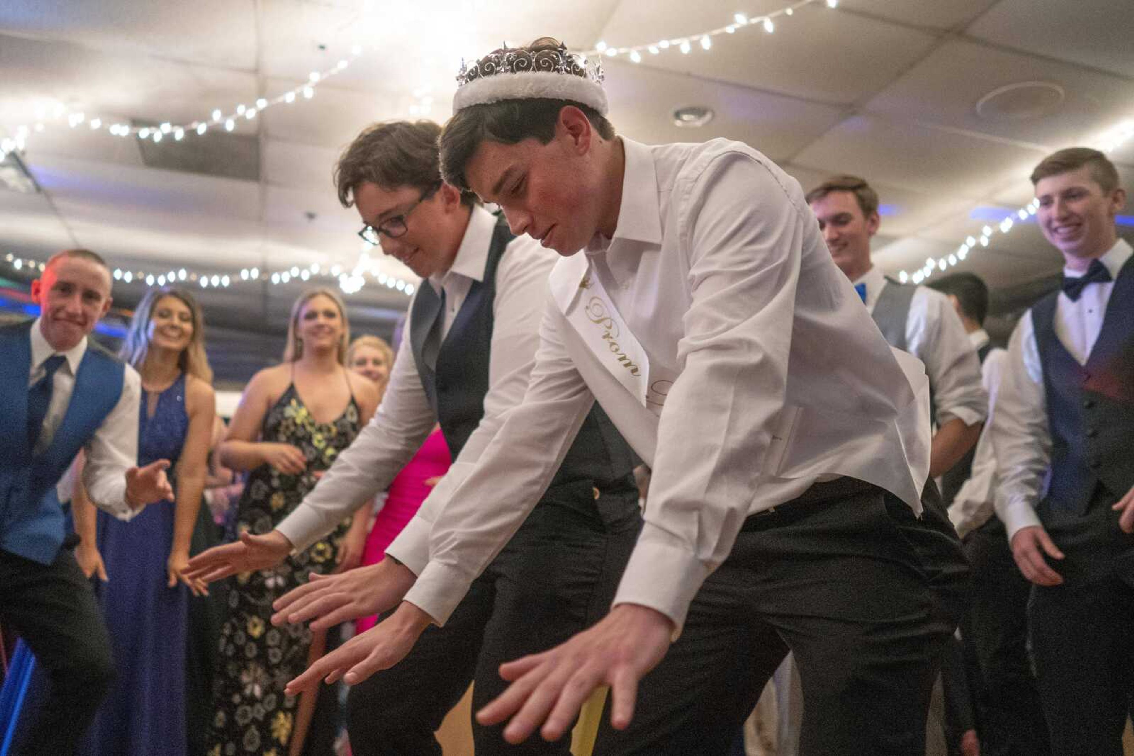 Prom King Alec Horn, right, and fellow prom court member Andrew Buxton prepare to dance during the Saxony Lutheran prom Saturday, April 26, 2021, at  the Elks Lodge in Cape Girardeau.